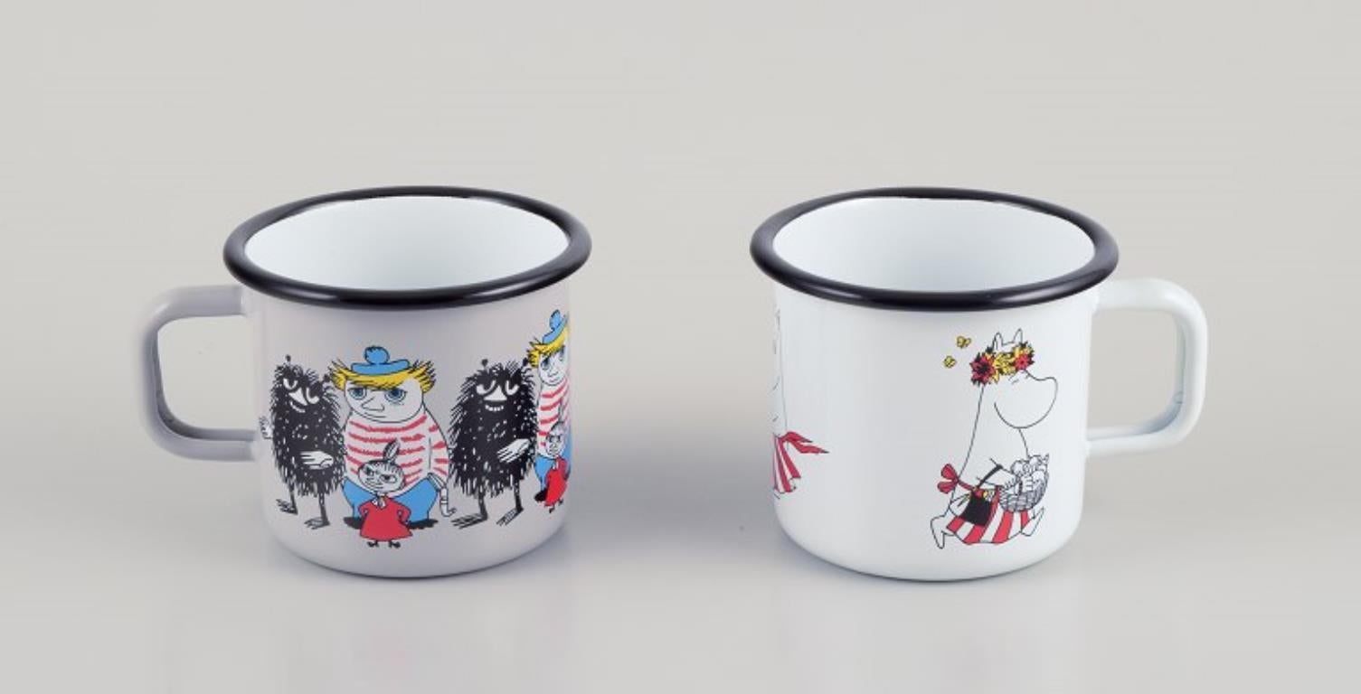 Finnish Muurla, Finland. Four enamel mugs with motifs from the Moomintroll stories For Sale