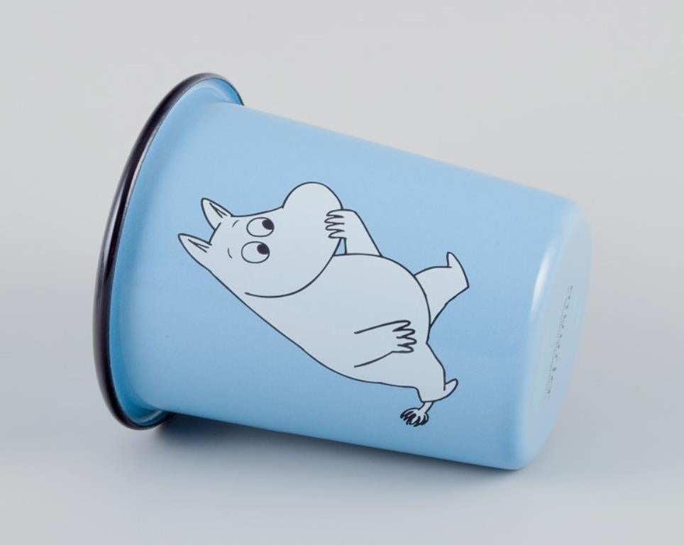 Contemporary Muurla, Finland. Three enamel mugs featuring motifs of Moomin trolls. For Sale
