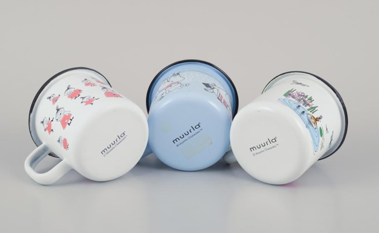 Muurla, Finland. Three enamel mugs with illustrations of Moomins For Sale 1