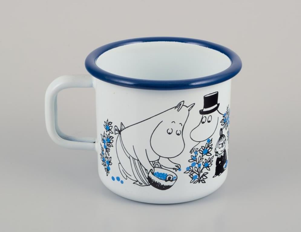 Contemporary Muurla, Finland. Two enamel mugs featuring illustrations of Moomins For Sale