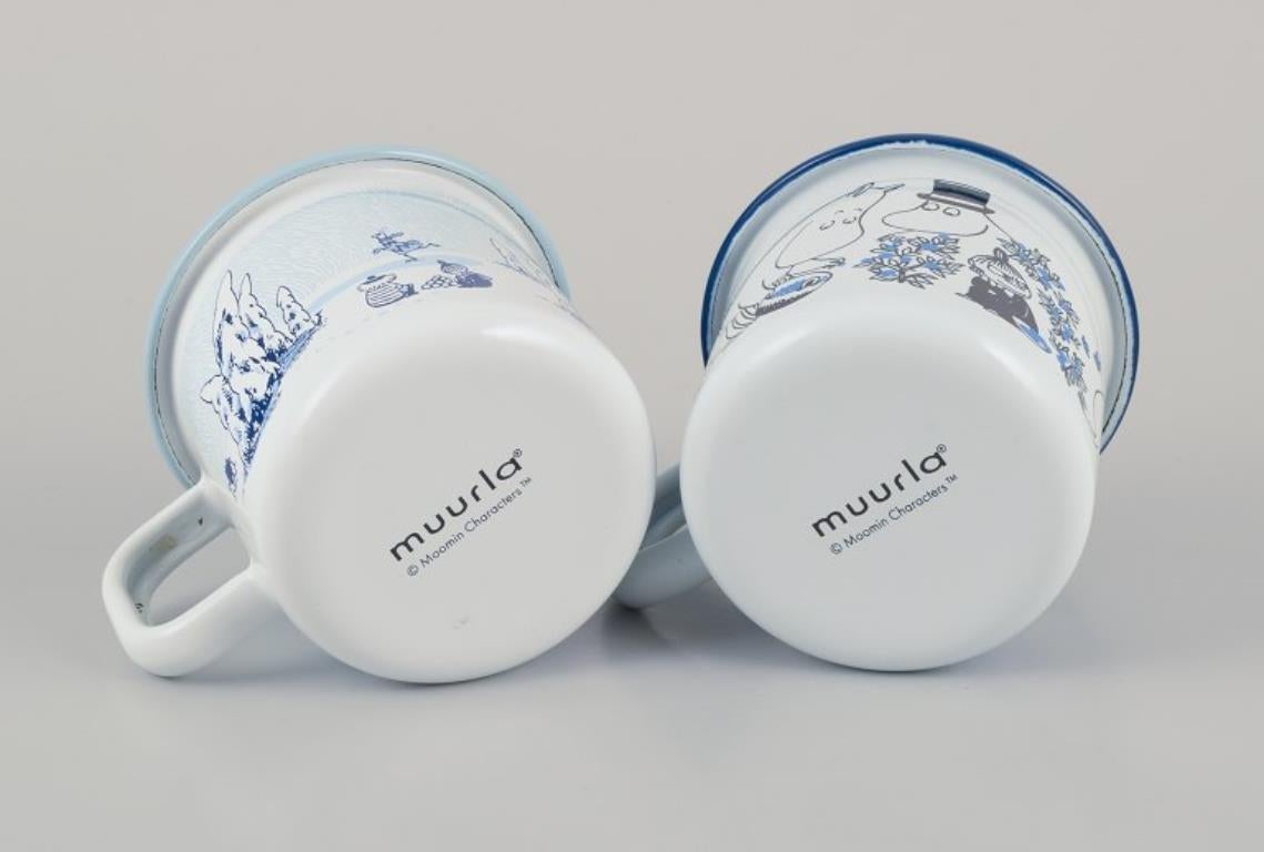 Metal Muurla, Finland. Two enamel mugs featuring illustrations of Moomins For Sale