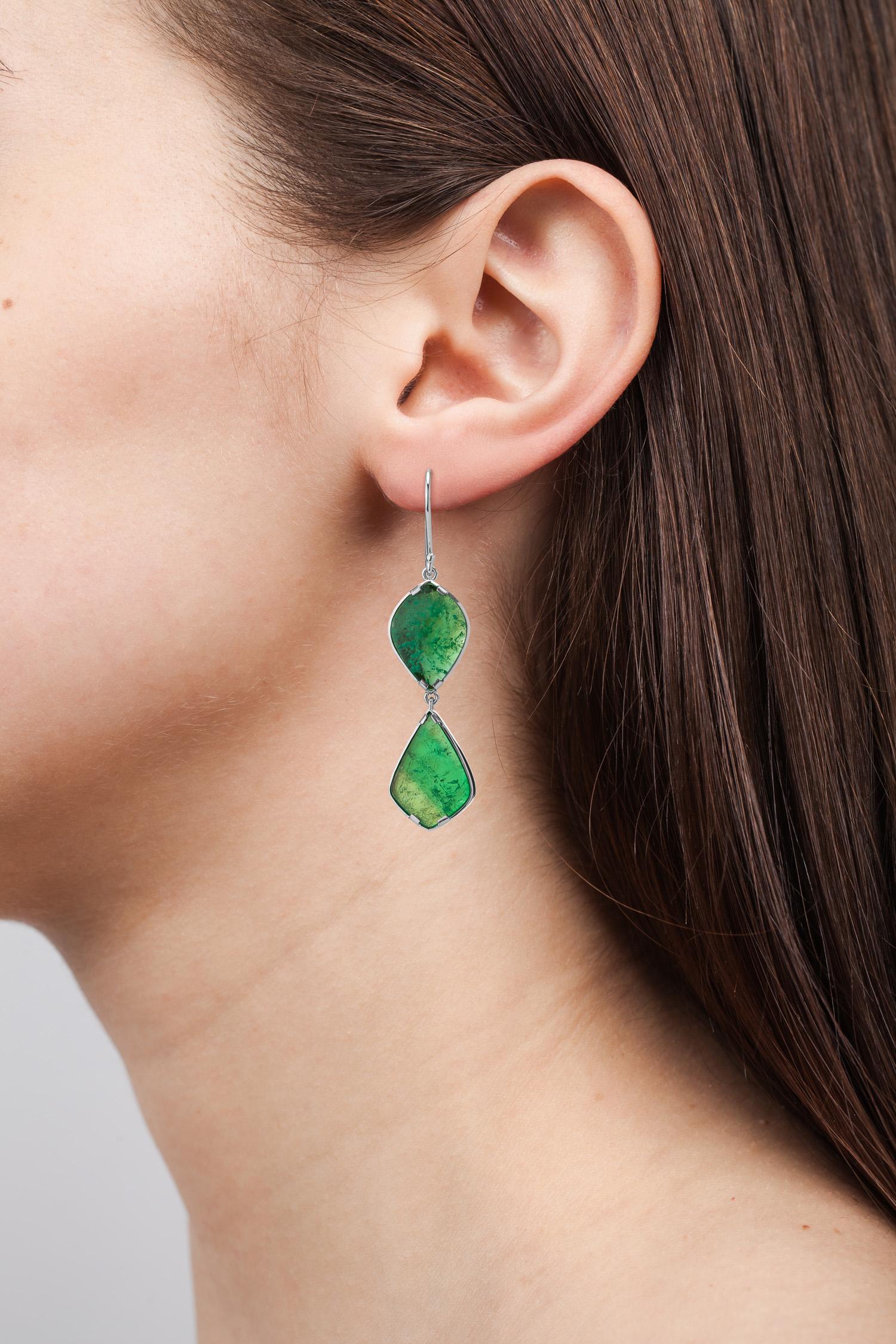 One of a kind 18 Karat white gold art deco style earrings set with Muzo colombian emerald slices weighing 14.79 carats.

Muzo Emerald Colombia Heritage Atocha Earrings set with 14.79 carats Emerald.

Atocha is inspired by a collection of jeweled