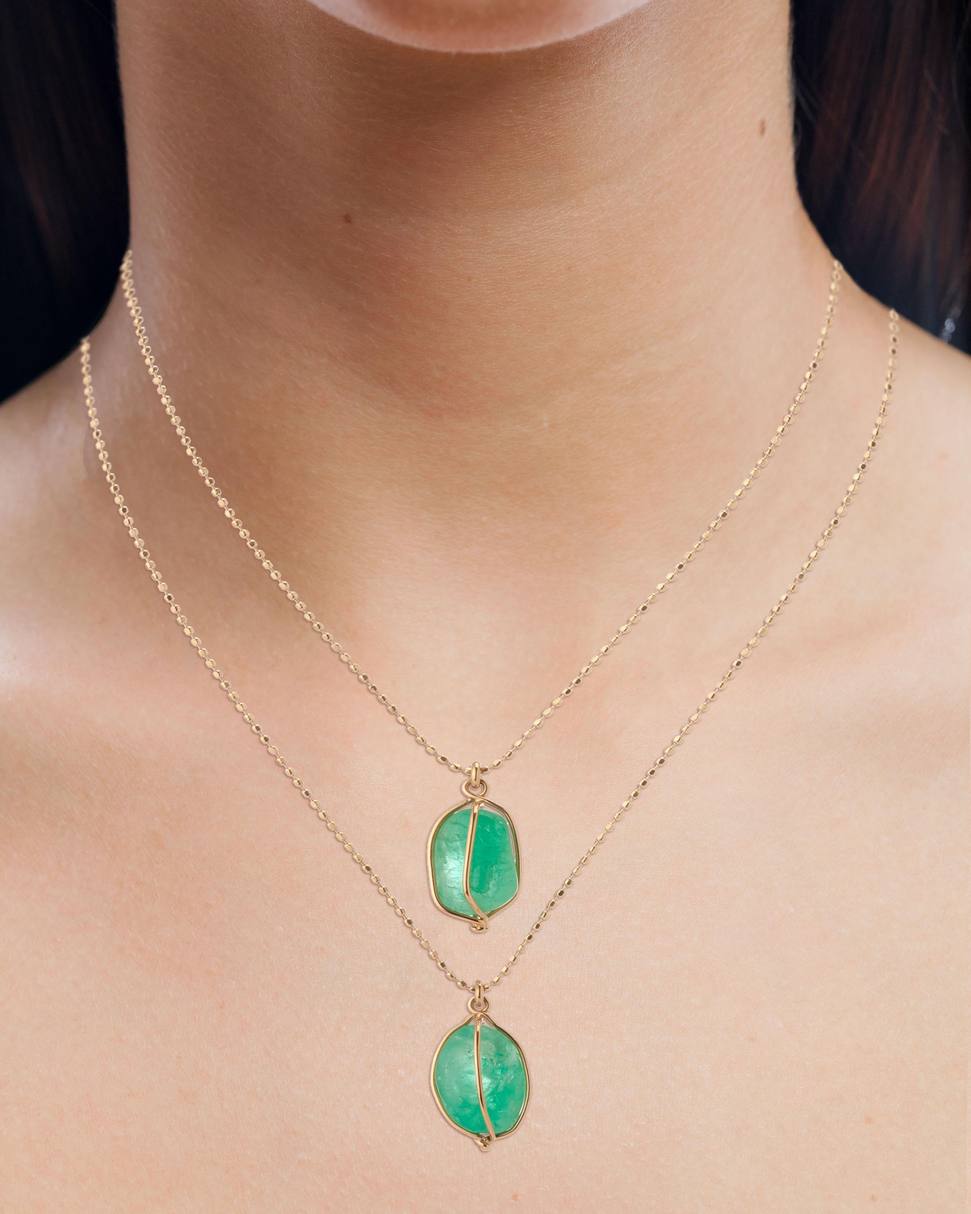 Contemporary double layered 18 Karat yellow gold Muzo Colombian emerald set in a basket weighing 8.98 carats. 

Muzo Emerald Colombia Heritage Chakana Pendant set with 8.98 carats Emerald.

Chakana takes its name from the sacred and mysterious Inca