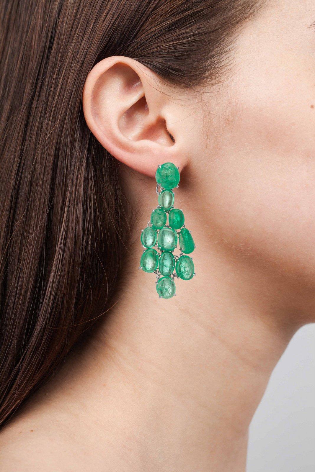 18 Karat white gold Chandelier earrings set with Muzo Colombian emeralds weighing 47.77 carats.

Muzo Emerald Colombia Heritage Muisca Earrings set with 47.77 carats Emerald.

Named in honor of the ancient indigenous people of the Muzo region of