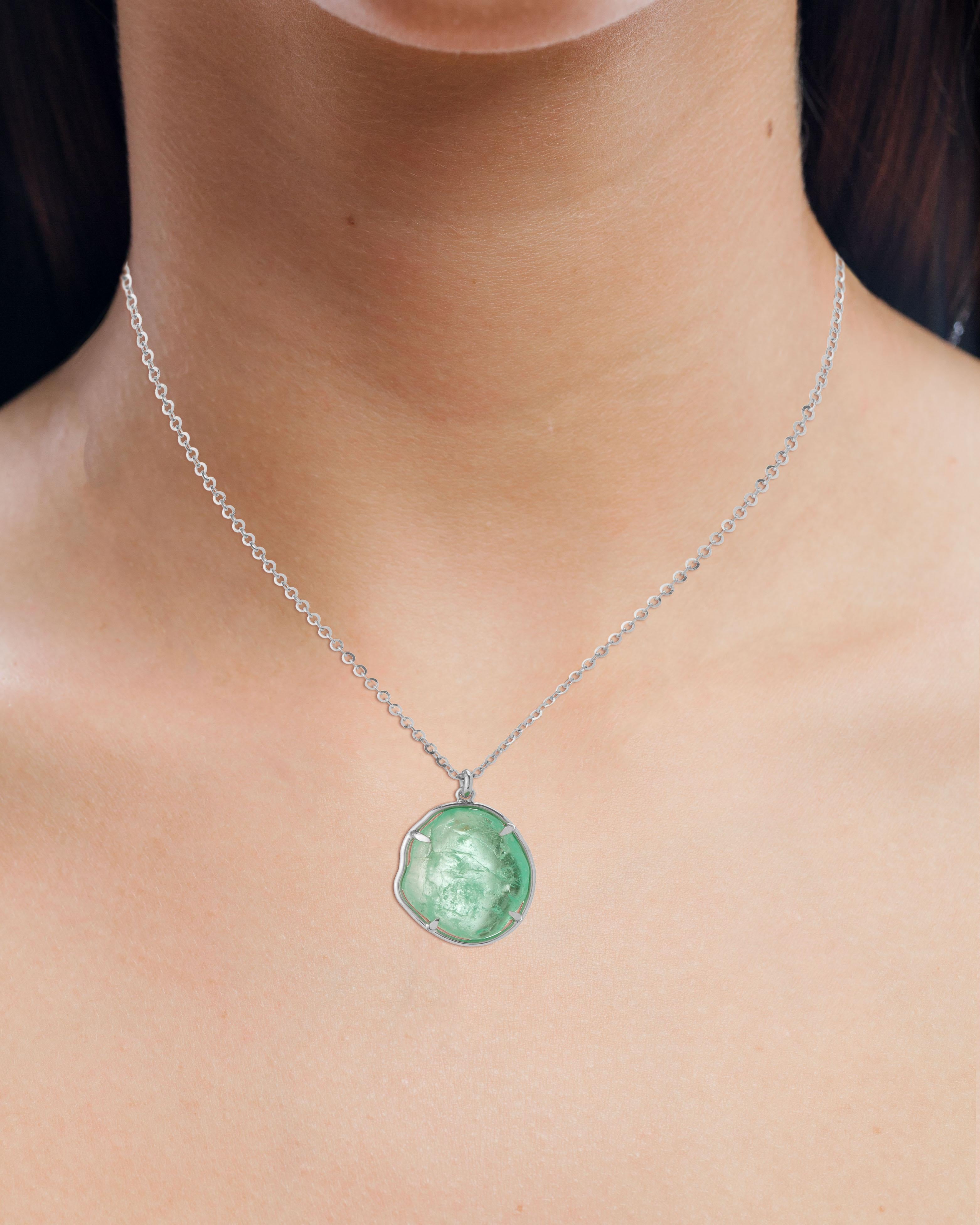 Contemporary 18 Karat white gold pendant set with an organic tumbled claw set Muzo Colombian emerald weighing 10.29 carats.

Muzo Emerald Colombia Heritage Chakana Pendant set with 10.29 carats Emerald.

Chakana takes its name from the sacred and