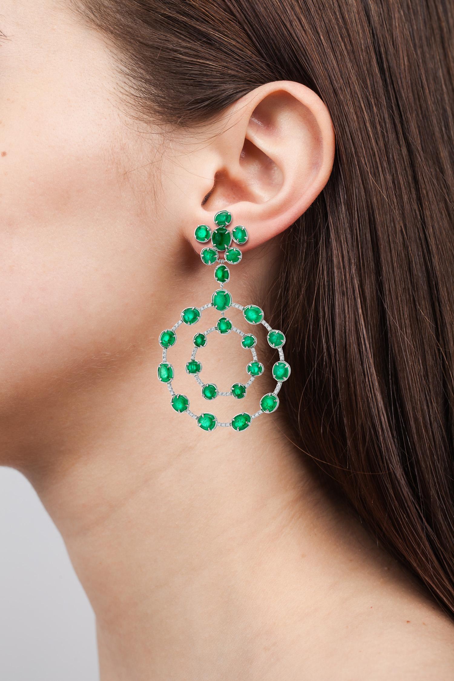 Contemporary statement earrings set in 18 Karat white gold with 67.25 carats of Muzo Colombian emeralds and 1.08 carats of diamond pave.

Muzo Emerald Colombia Heritage Royal Orb Earrings set with 67.25 carats Emerald.

One of 3 artifacts from the