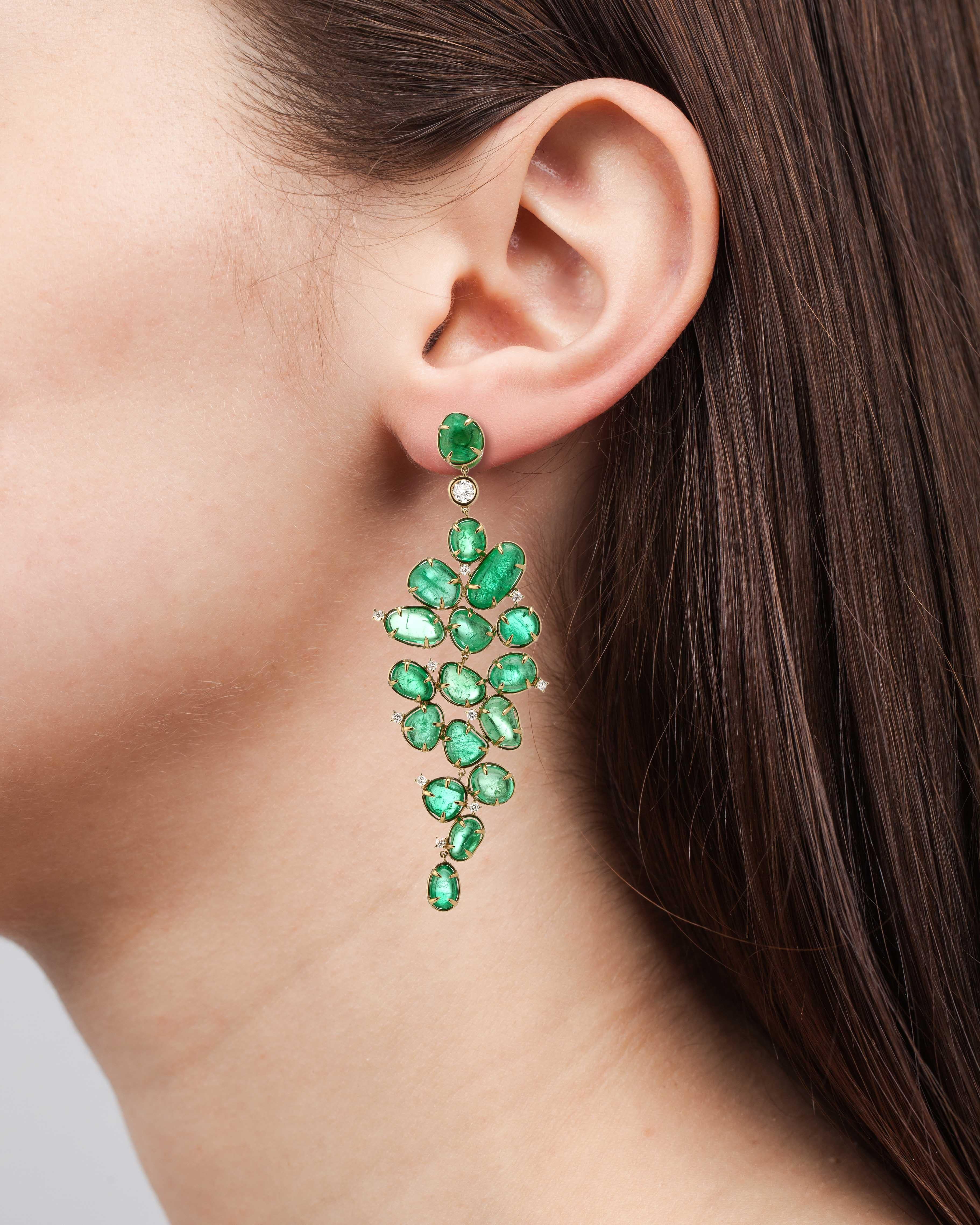 Baroque style 18 Karat yellow gold earrings set with organic Muzo emeralds of 65.53 carats and 1.57 carats of brilliant cut diamonds.

Muzo Emerald Colombia Heritage Muisca Earrings set with 65.53 carats Emerald

Named in honor of the ancient