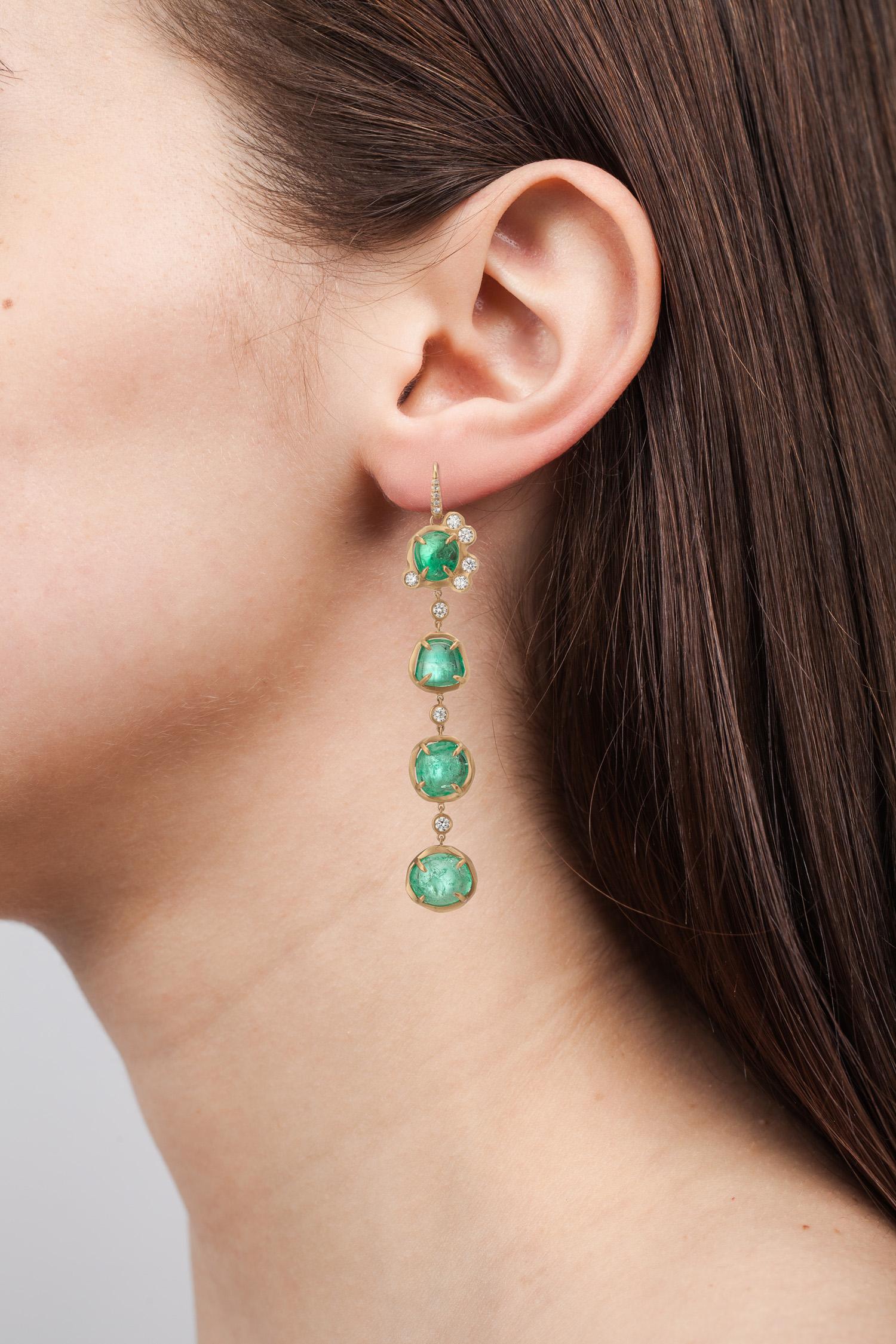 18 Karat yellow gold drop earrings set with alternating Muzo Colombian emeralds of 38.94 carats and single set diamonds weighting 1.25 carats.

Muzo Emerald Colombia Heritage Muisca Earrings set with 38.94 carats Emerald.

Named in honor of the