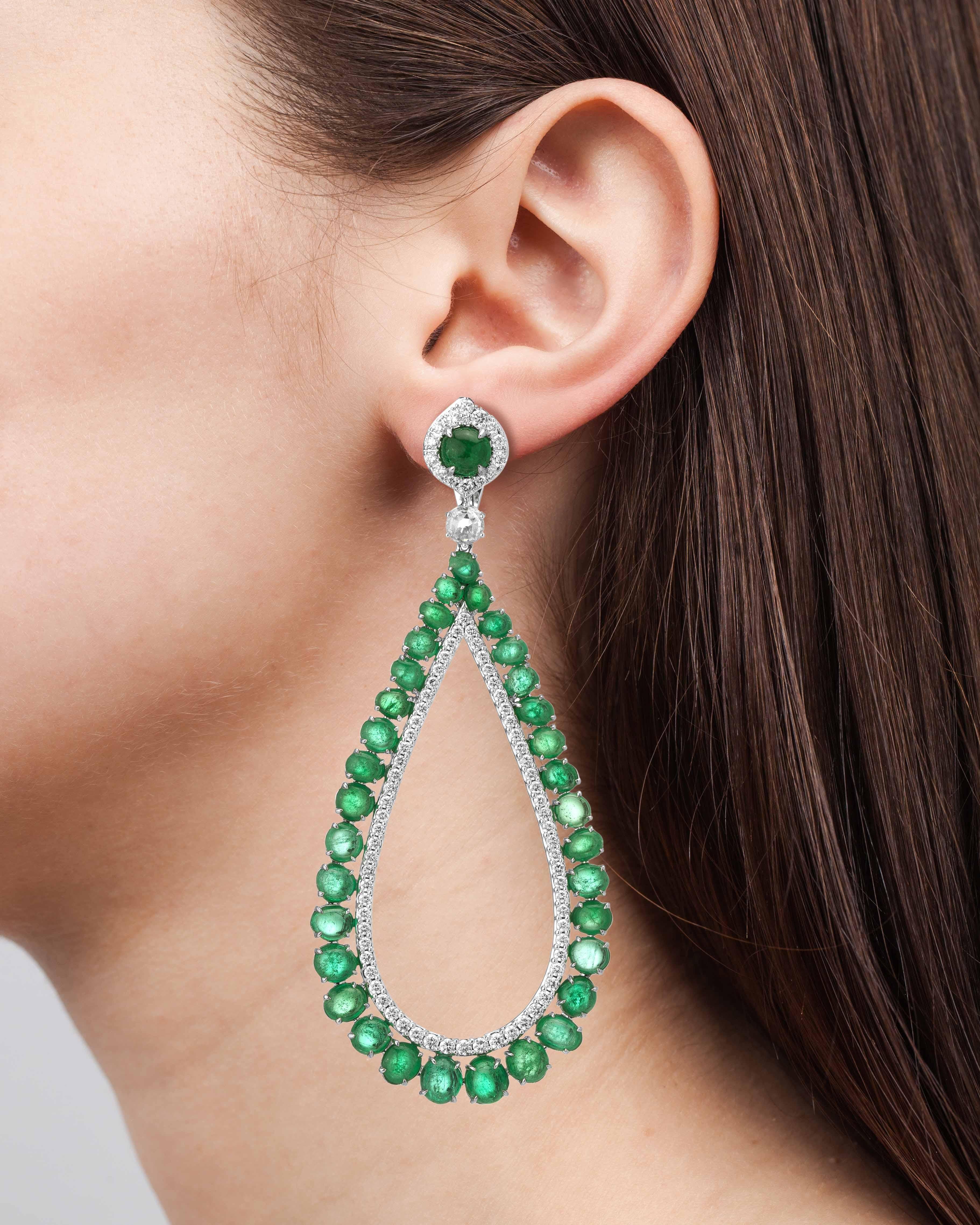 Large modern cocktail earrings set with round brilliant diamonds weighing 6.11 carats accenting the 38.25 carats of Muzo Colombian emeralds.

Muzo Emerald Colombia Heritage Verity Earrings set with 38.25 carats Emerald

Verity is a tribute to the