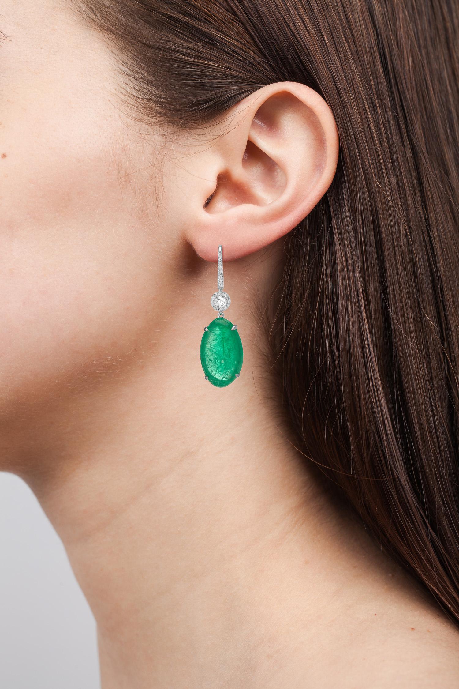 Classic 18 Karat white gold earrings set with 0.51 carats of round brilliant diamonds and Muzo Colombian emeralds weighing 18.85 carats.

Muzo Emerald Colombia Heritage Atocha Earrings set with 18.85 carats Emerald.

Atocha is inspired by a