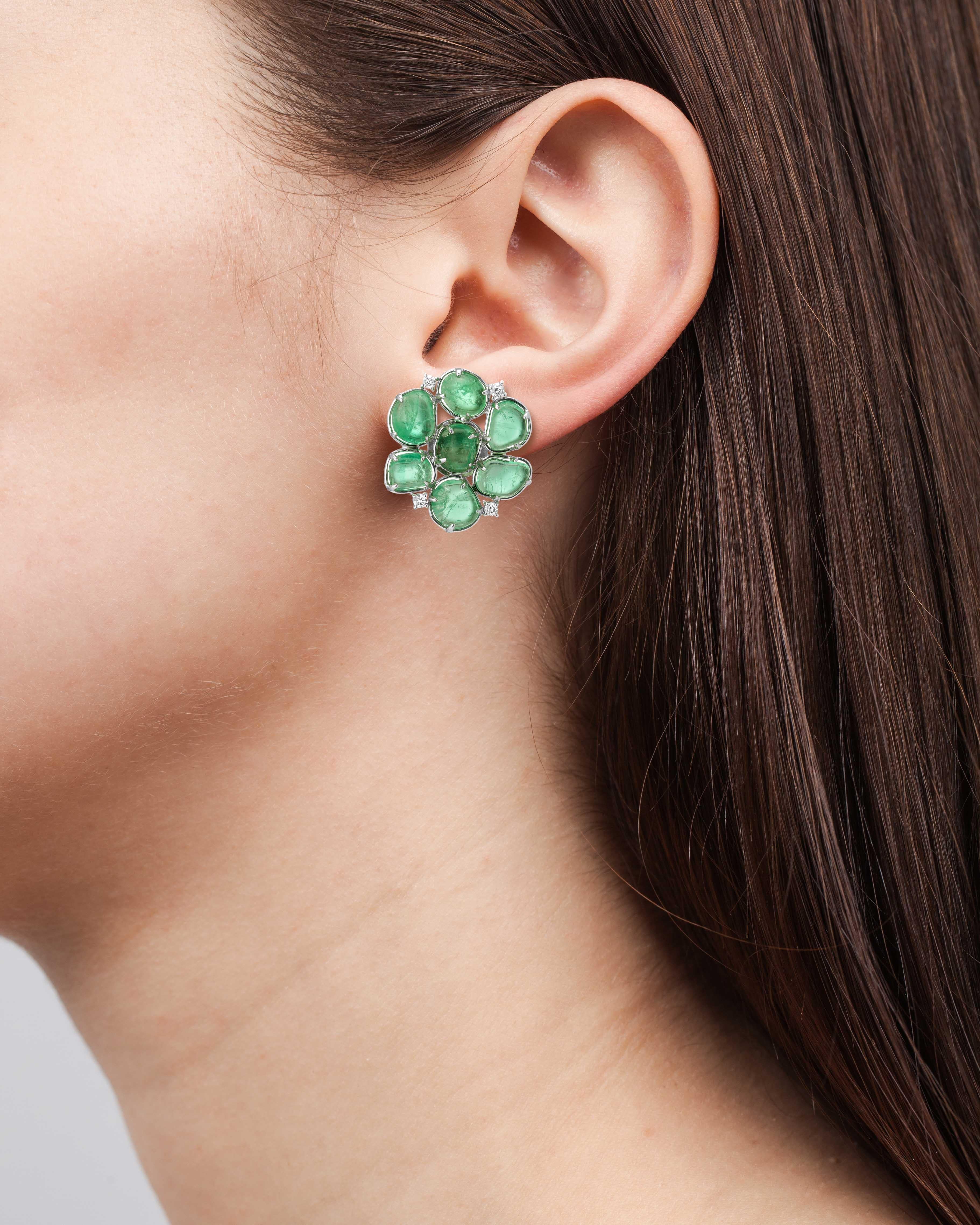 Flower Motif emerald studs set with 18 Karat white gold and Muzo emerlds of 29.58 carats and round brilliant diamonds as accents of 0.35 carats.

Muzo Emerald Colombia Heritage Royal Orb Earrings set with 29.58 carats Emerald.

One of 3 artifacts