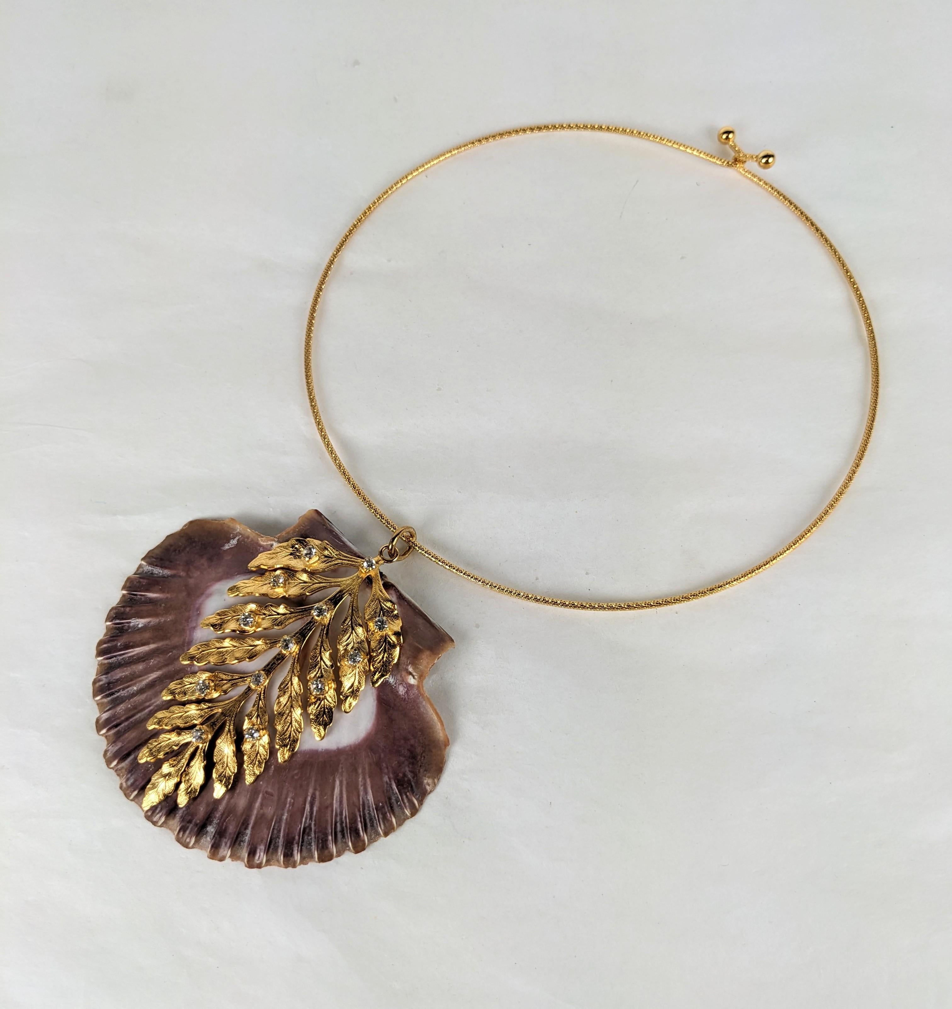 MWLC Purple Lion Paw Scallop Shell pendant necklace from MWLC. The natural shell decorated with a gilt plate bronze fern frond, decorated with prong set crystal rhinestones, made in the Parisian studios of MWLC. Textured matte necklet. Purple Pecten
