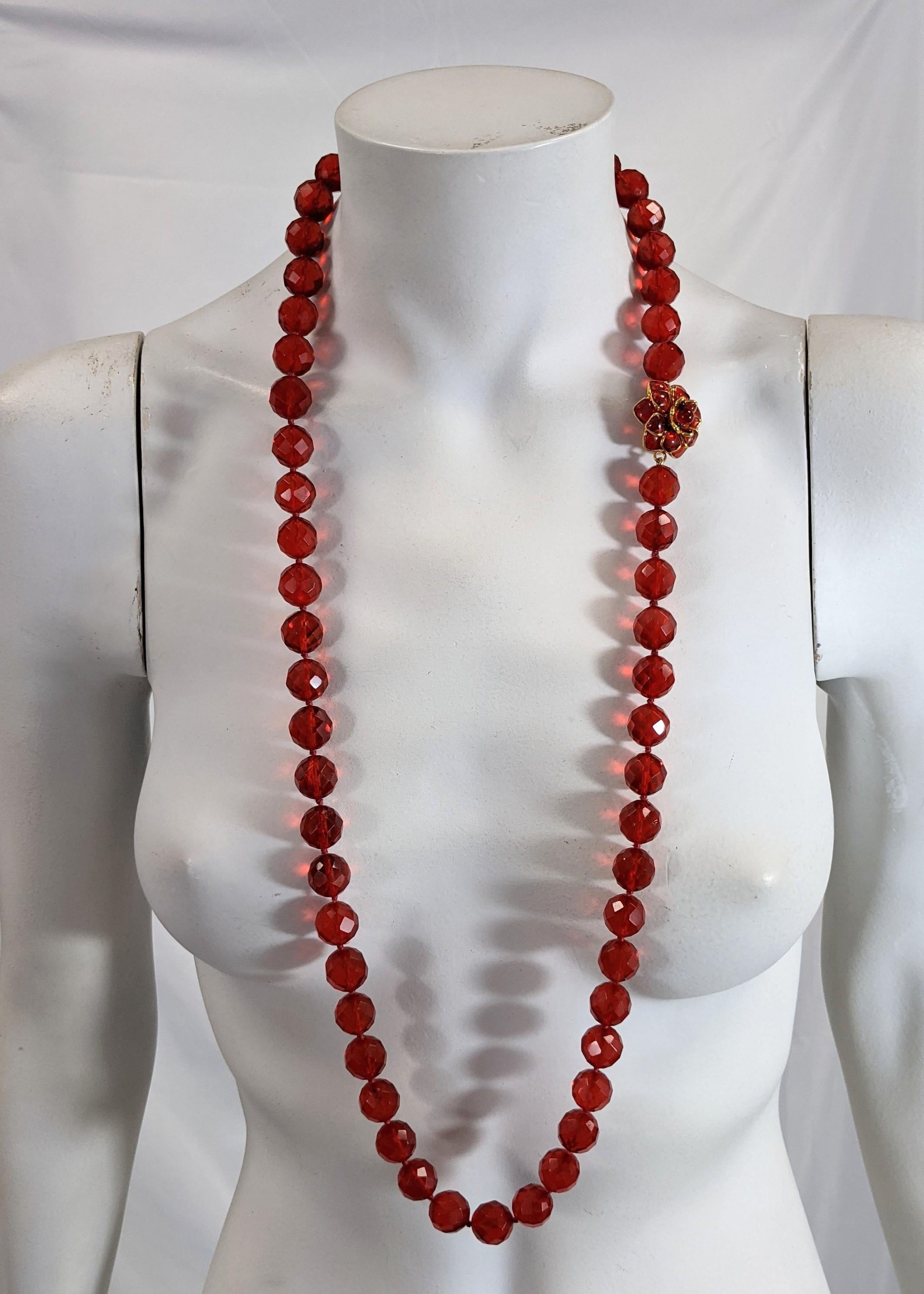 Versatile MWLC Zinnia Poured Glass Long Quartz Beads made to look like faceted amber. Hand knotted super long strand of 15 mm beads with hand made poured glass zinnia clasp in matching glass paste tone. 
Made in the Parisian workshops of MWLC. Clasp