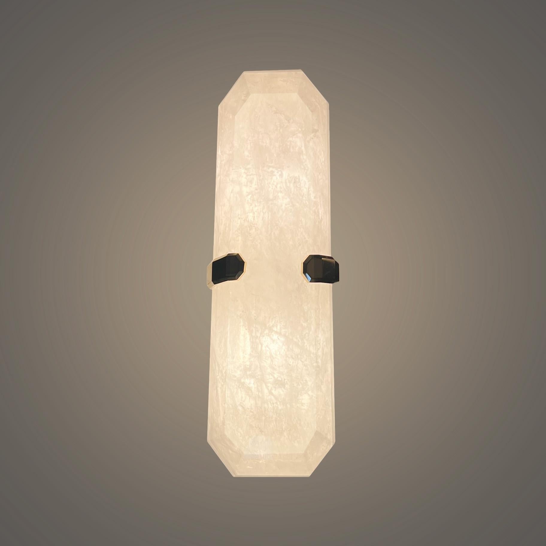Pair of finely carved multifaceted rock crystal sconces. two sockets installed.160w total. Recommend jbox 2in x 4in .Created by Phoenix.custom size upon request.