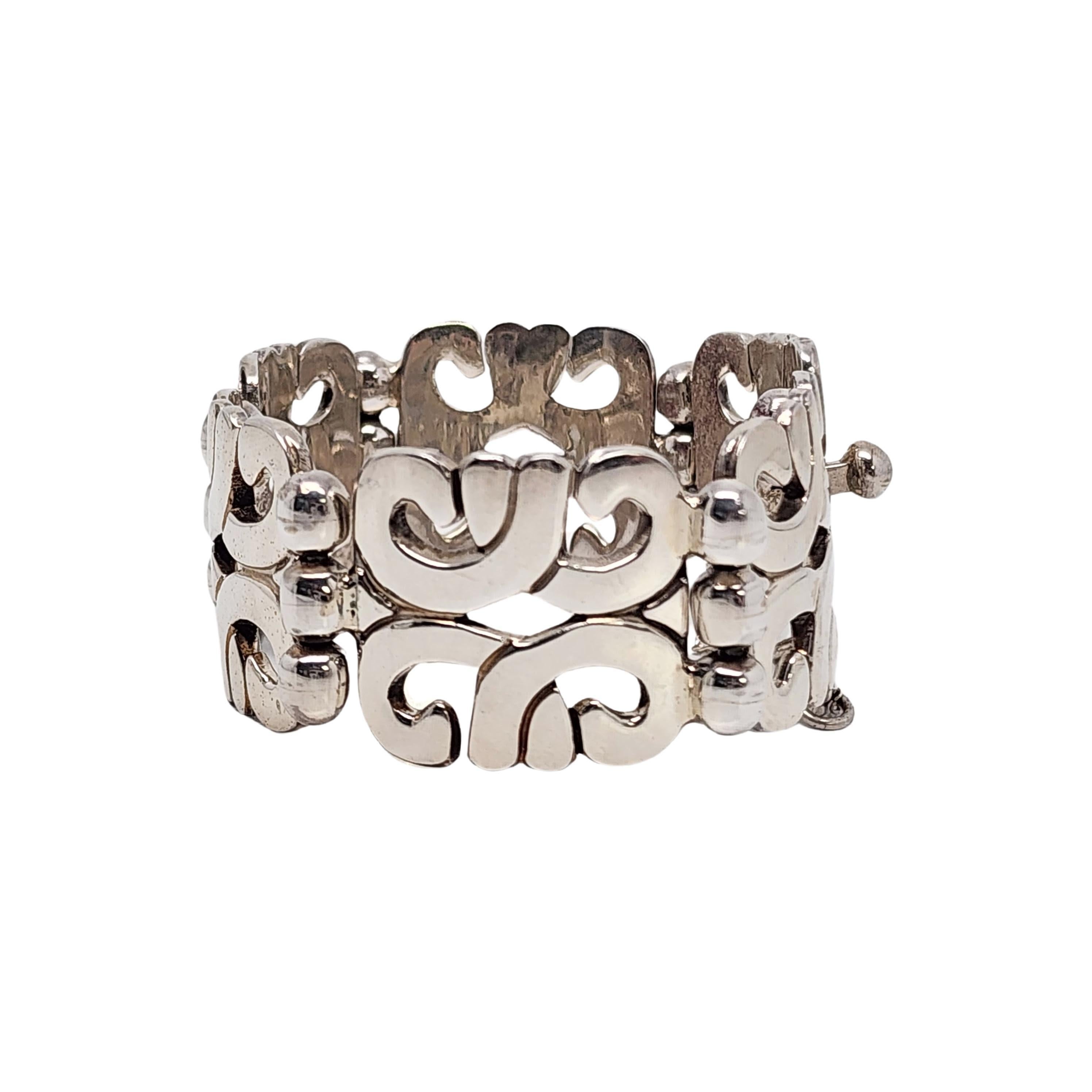 Sterling silver panel link bracelet by Mark Wasserman Samara of Mexico.

A large and significant bracelet featuring Aztec inspired geometric design panel links with push box clasp and safety chain.

Weighs approx 93.7g, 60.3dwt

Measures approx 7