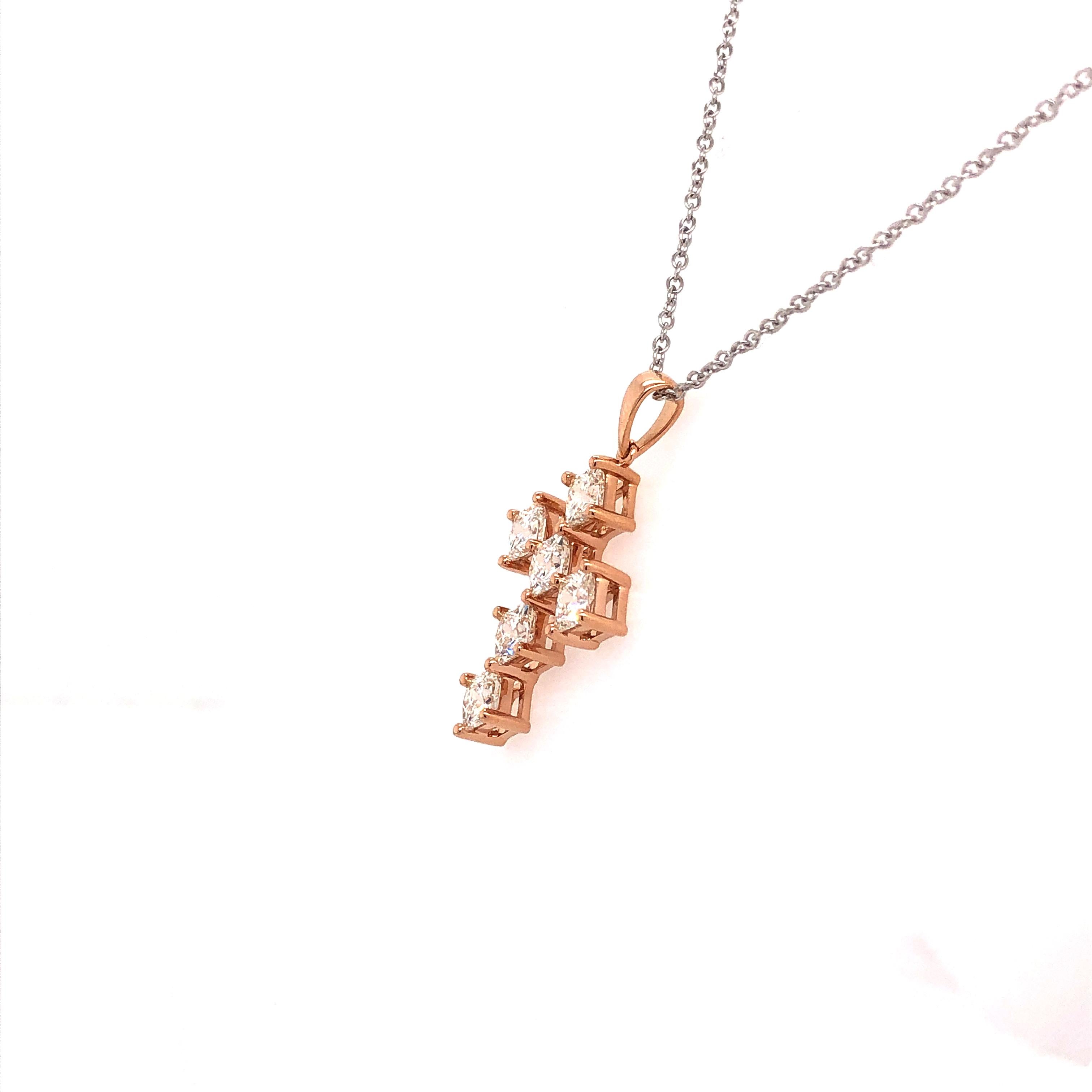 Six expertly calibrated My Girl diamonds are beautifully matched to achieve this design. The diamond cross pendant shown contains My Girl diamonds weighing 2.32 ct I-J Color and VVS Clarity and are set diagonally in 18K rose gold.

This design is