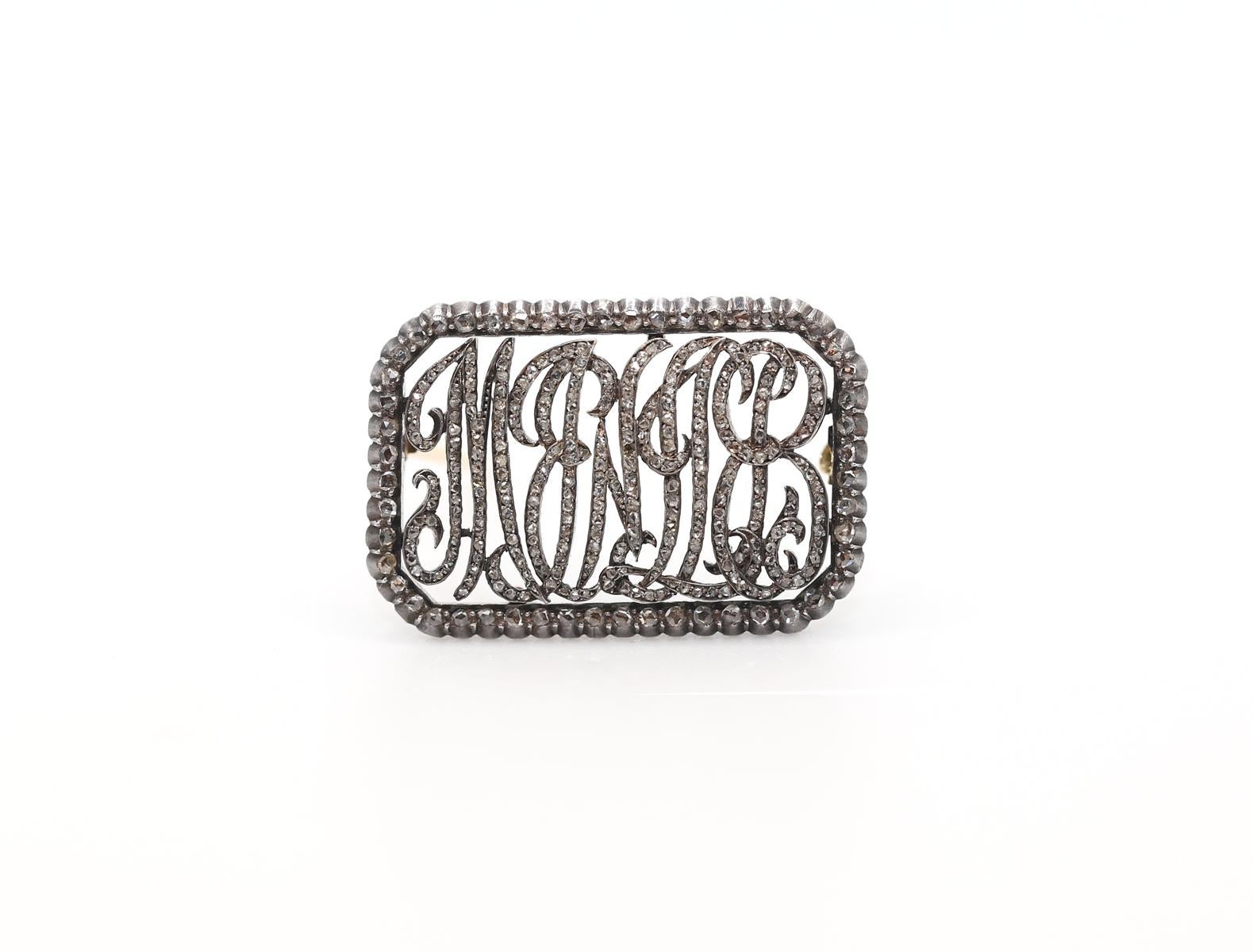 My Love Meine Liebe Diamonds Brooch. 
My Love or Meine Liebe highly collectable brooch. The inscription is written in the German language, in Victorian italic font, while all the letters and the frame are set with fine Old European cut Diamonds. It
