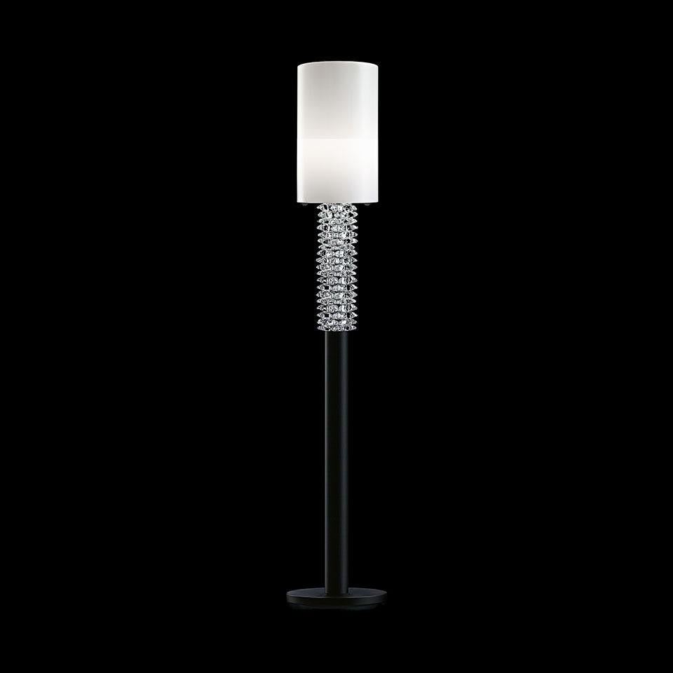 The My Marylin floor lamp was originally Desigined by Giorgia Brusemini in 2007 for Barovier&Toso. The diffuser made of white glass and precious rock crystals that, like bracelets, wrap around the base of the lamp almost like the arm of a movie