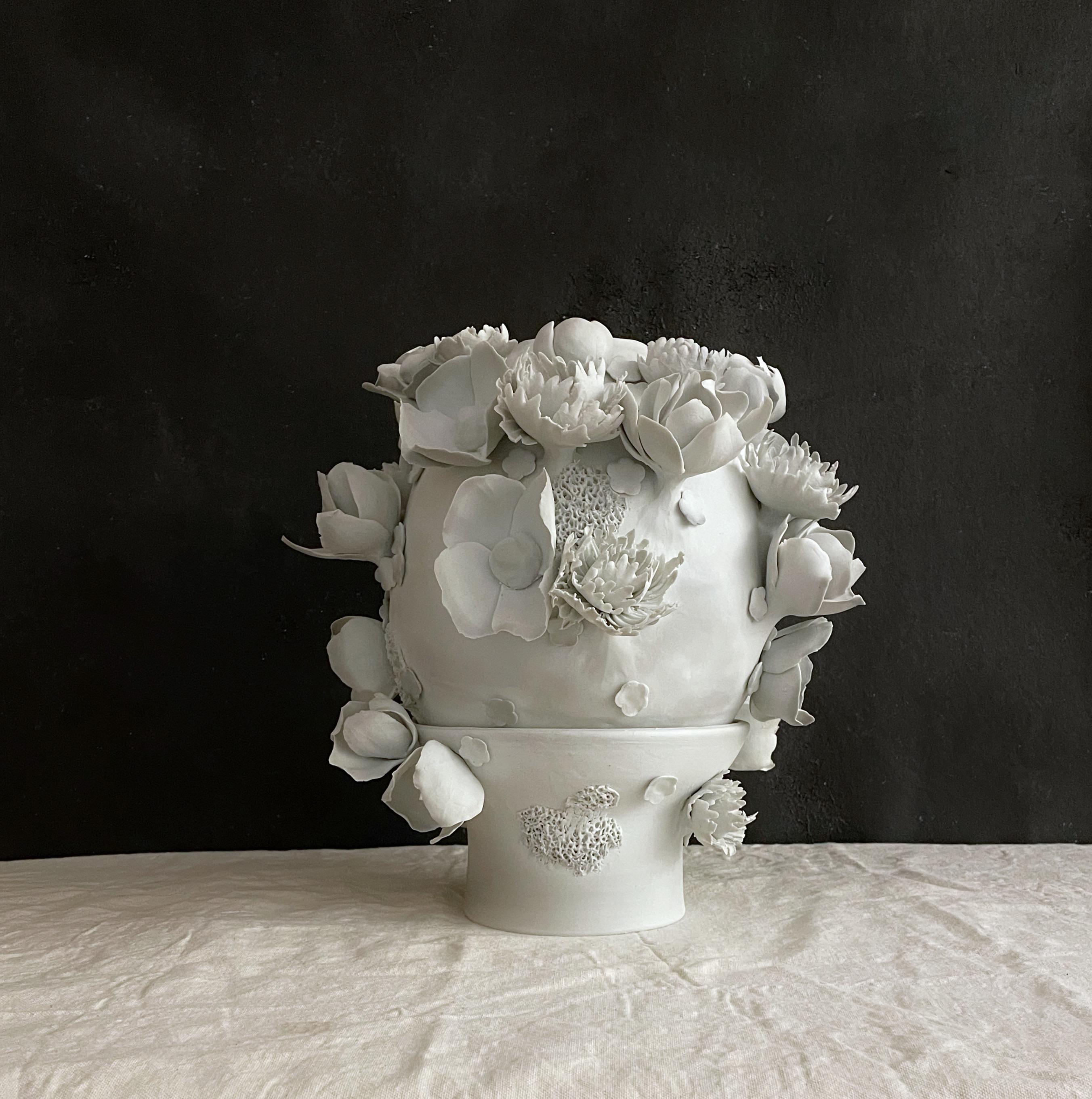 This one of a kind, two piece sculpture hand built and decorated with porcelain flowers and finished with the pure porcelain touch with only glaze inside.

Dear You Ceramics is a Brooklyn based ceramic studio specializing in creating sculptural,
