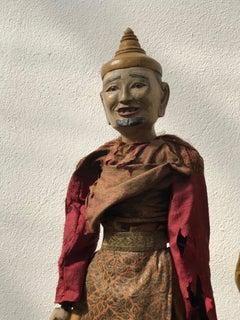 Myanmarese doll in red robes