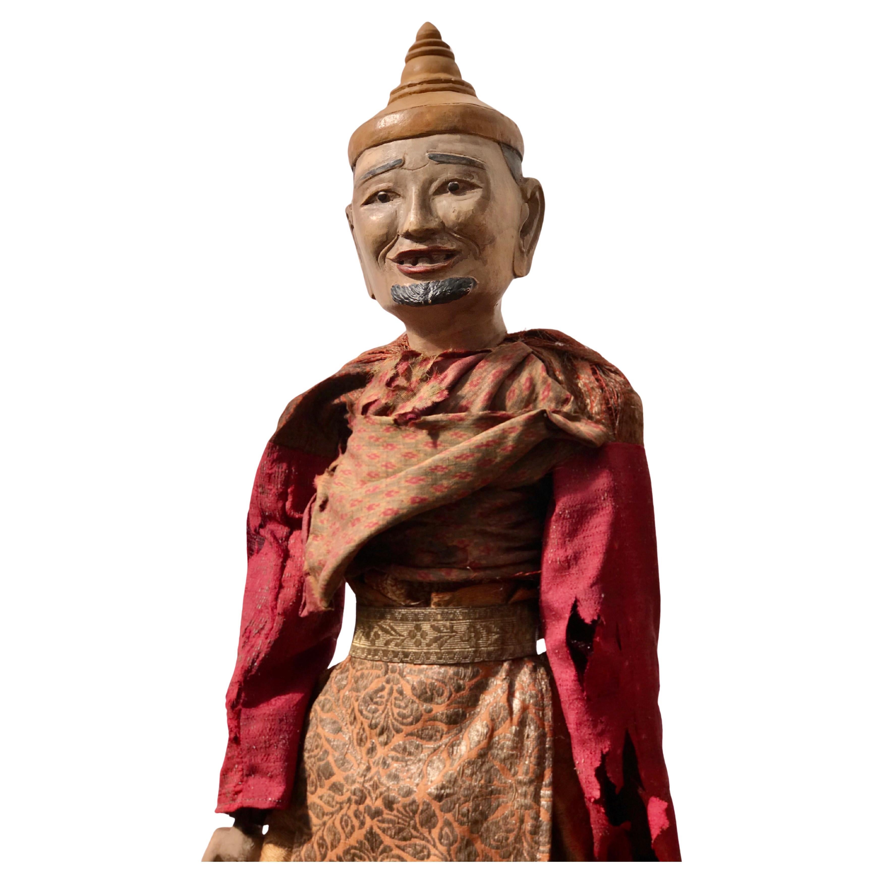 Myanmarese doll in red robes