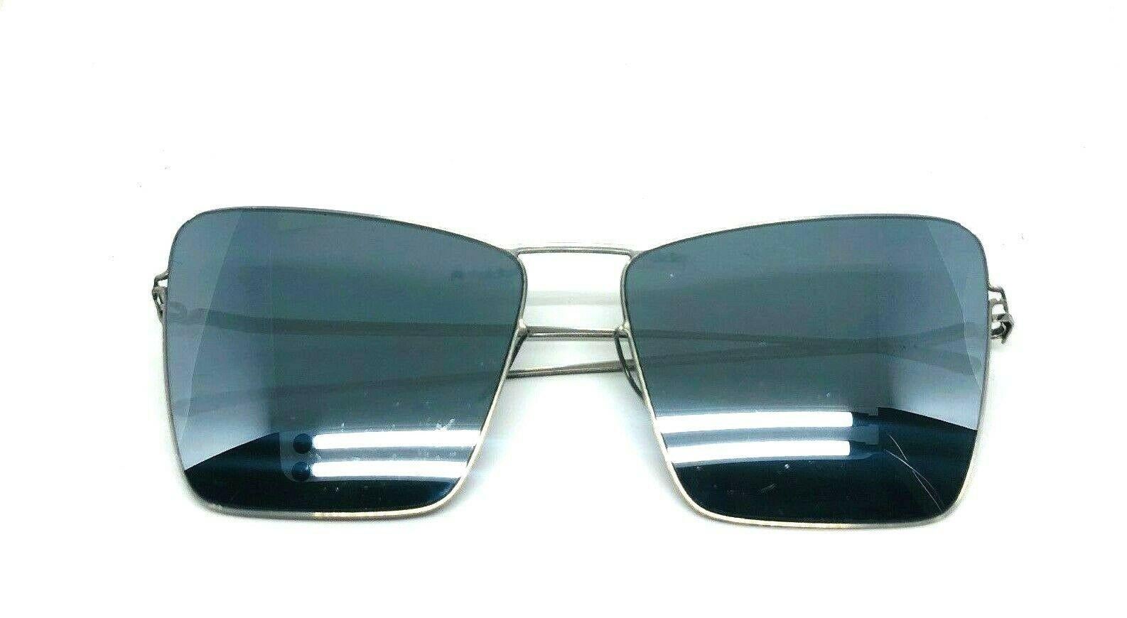 MYKITA Damir Doma Maison Margiela Square Mirror Sunglasses

Color: Black

Measurements:  5.25”W x 2”L

Details: Signed by MYKITA + Maison Margiela, stamped MMESSE014, COLE1, Size 140, 59 16

Comes with the original case.

Made in Germany.