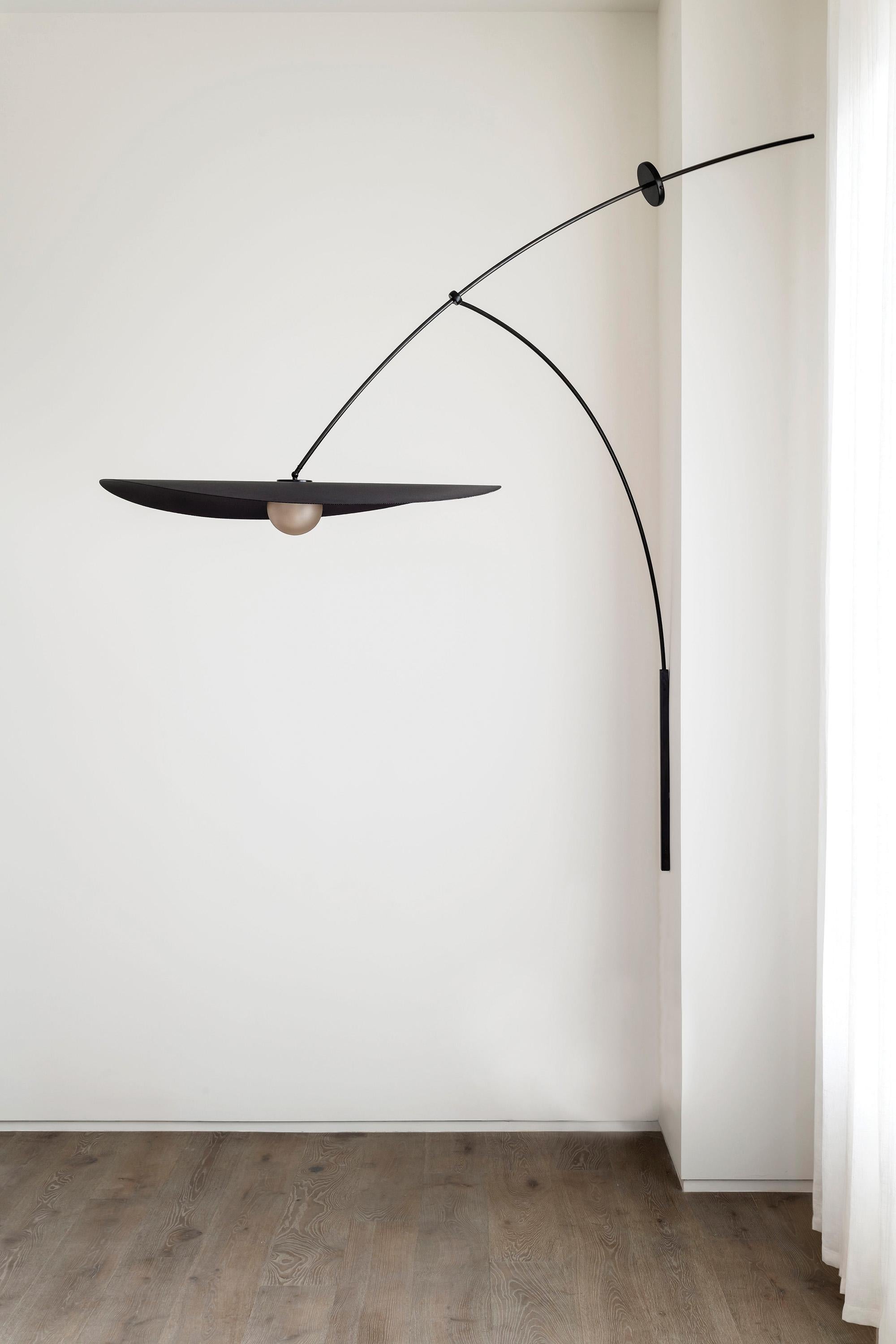 L&G Studio is proud to present a Myrna, capturing a moment of suspension in space.

The Myrna Wall Mounted light is a large scale light sculpture suspended from the wall and carefully balanced on an articulating, adjustable arm. The height of the