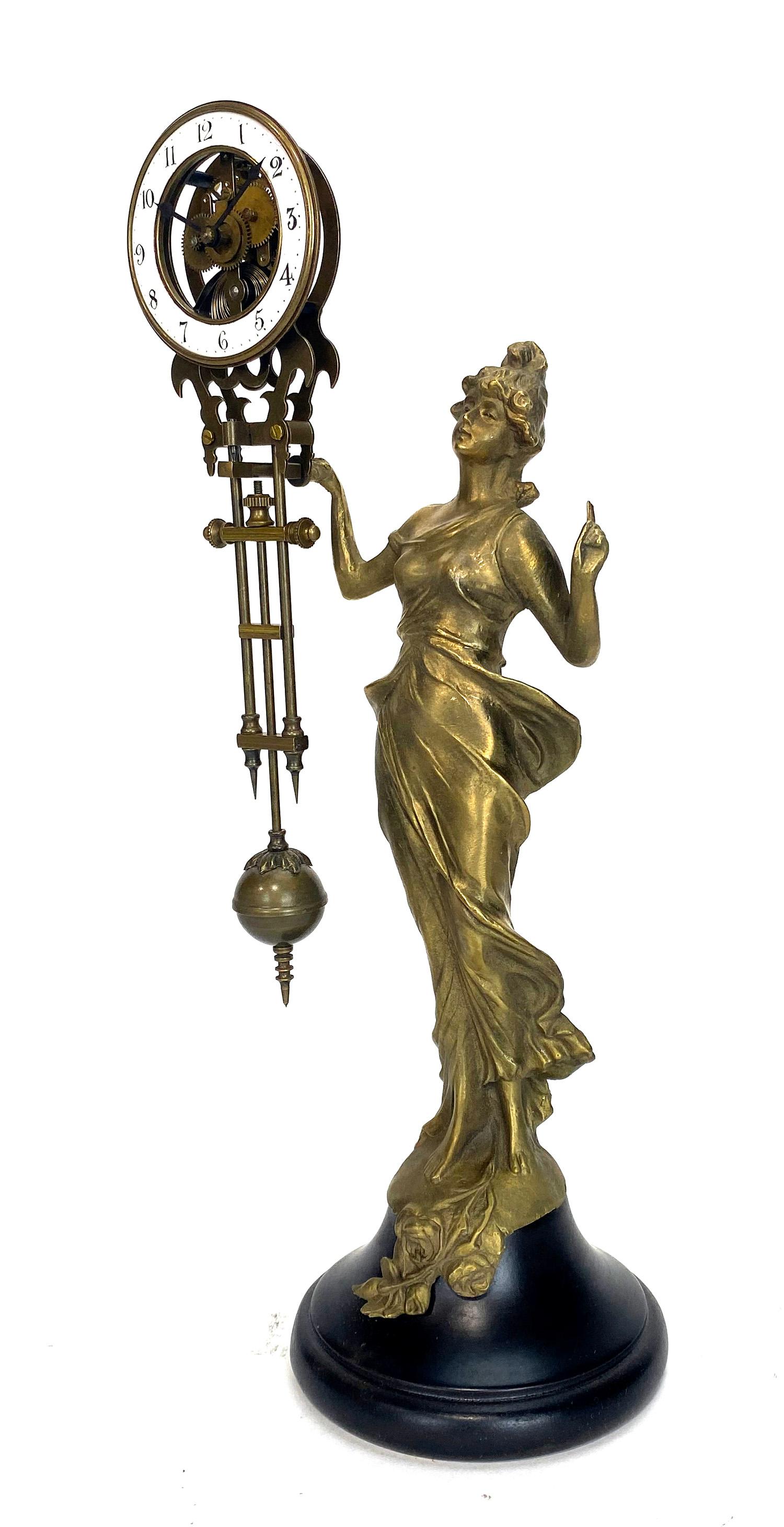 Mystery Diana swinging swinger clock with 8 day skeleton movement.

Solid brass cast lady Diana statue with a wood base. Hand painted 2