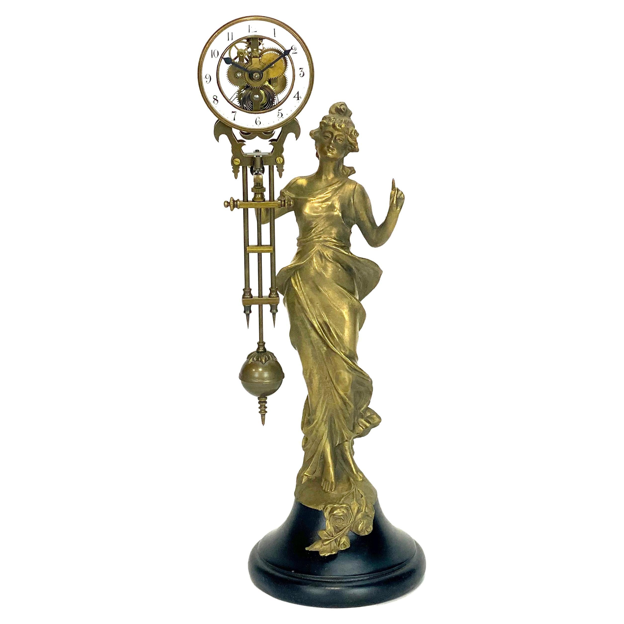 Mystery Brass Diana Figure Swinging Clock with 8 Day Skeleton Movement For Sale at 1stDibs photo