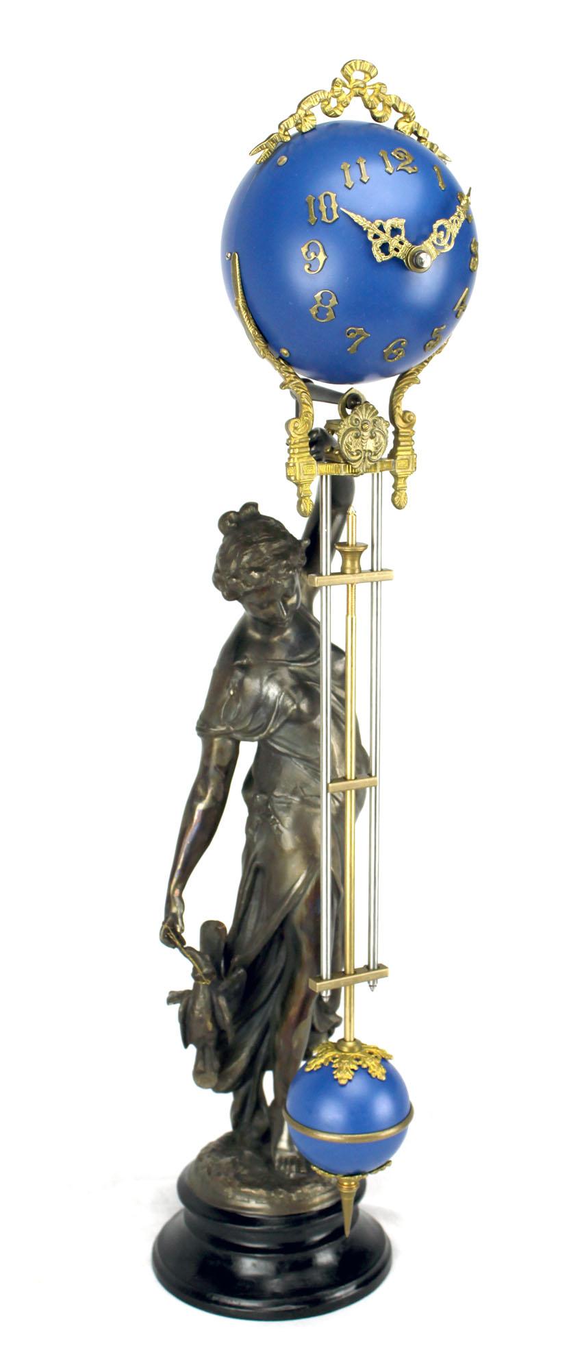 Here is an excellent condition brass Huntress lady figure mystery swinging clock. It comes with an 8 day wind up mechanical movement. Time reads from the decorative brass hands over matte cobalt blue color brass 4