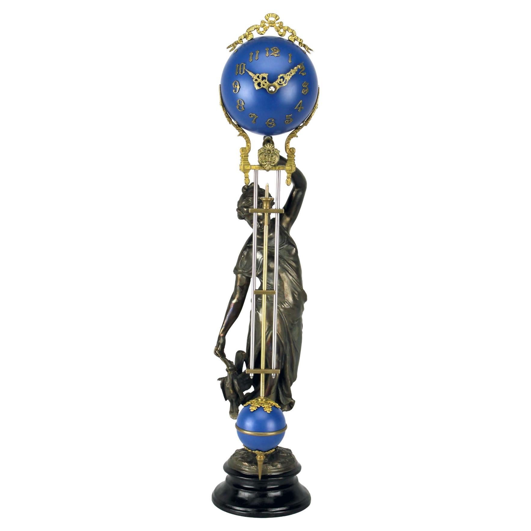 Mystery Cobalt Blue Ball 8 Day Brass Huntress Lady Statue Swinging Clock For Sale