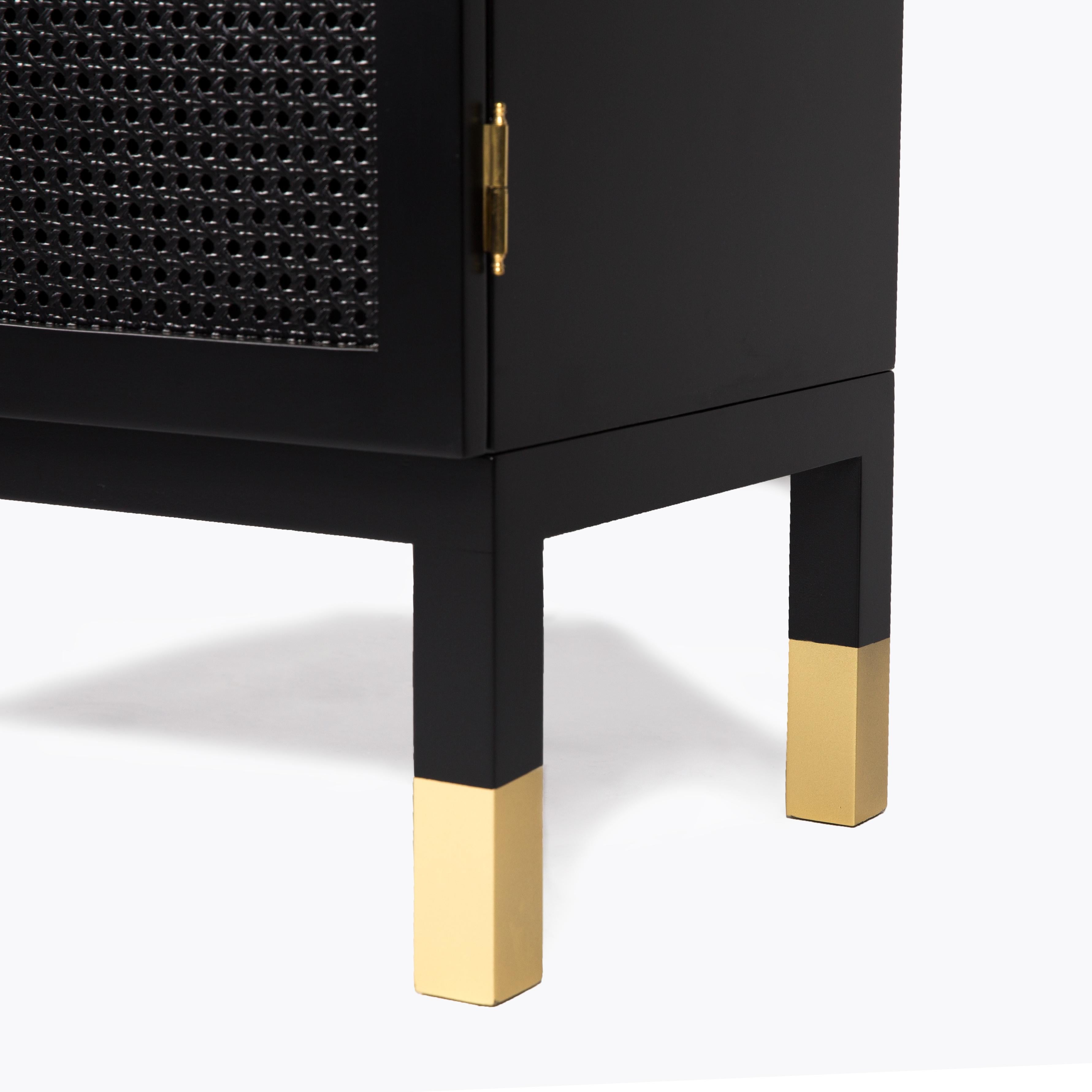 Mystery is a handcrafted cabinet featuring an oval design in a matte lacquered finish. The tight, pulled woven cane will never give an idea of what's inside the cabinet, always protecting its mystery. 

Produced with solid wood, cane, ebony lacquer