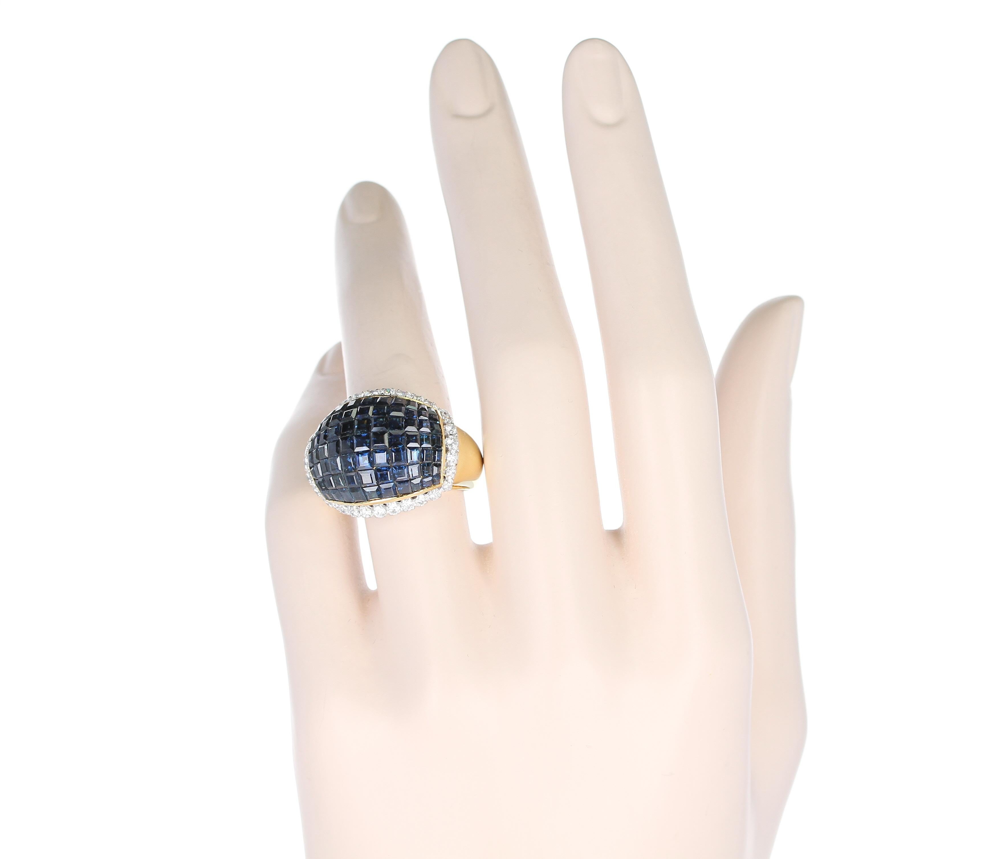 A Mystery Set Blue Sapphire and Diamond Bombe Ring in 18K Yellow Gold. 
Ring Size US 9. 
Total Weight: 16.64 grams.