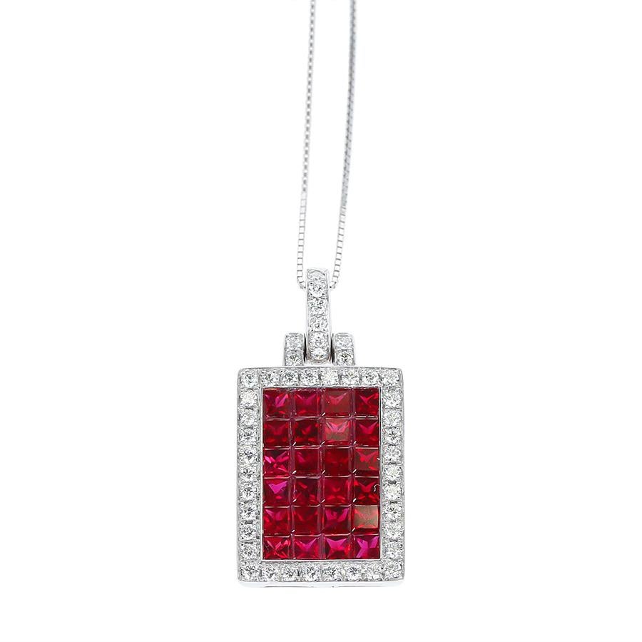 A Mystery Set Rectangular Ruby and Diamond Pendant in 18K White Gold. 
Ruby Weight: 4.88 carats, Diamond Weight: 0.78 carats. Total Weight: 13.70 grams.