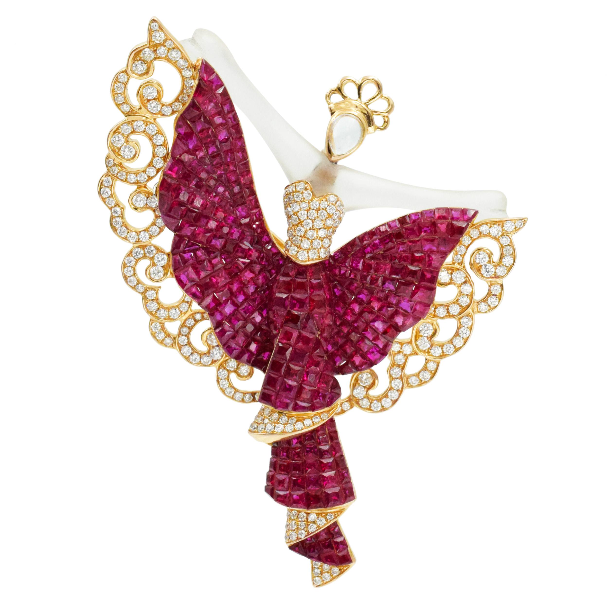 MYSTERY set ruby, diamond and crystal brooch in 18k yellow gold. Equipped with double pin and thrombone lock. The dress of the dancer is set with total of approximately 18.00 ct of mystery set rubies and 258 of round brilliant cut diamonds with