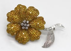 Mystery-Set Yellow Sapphire and Diamond Brooch