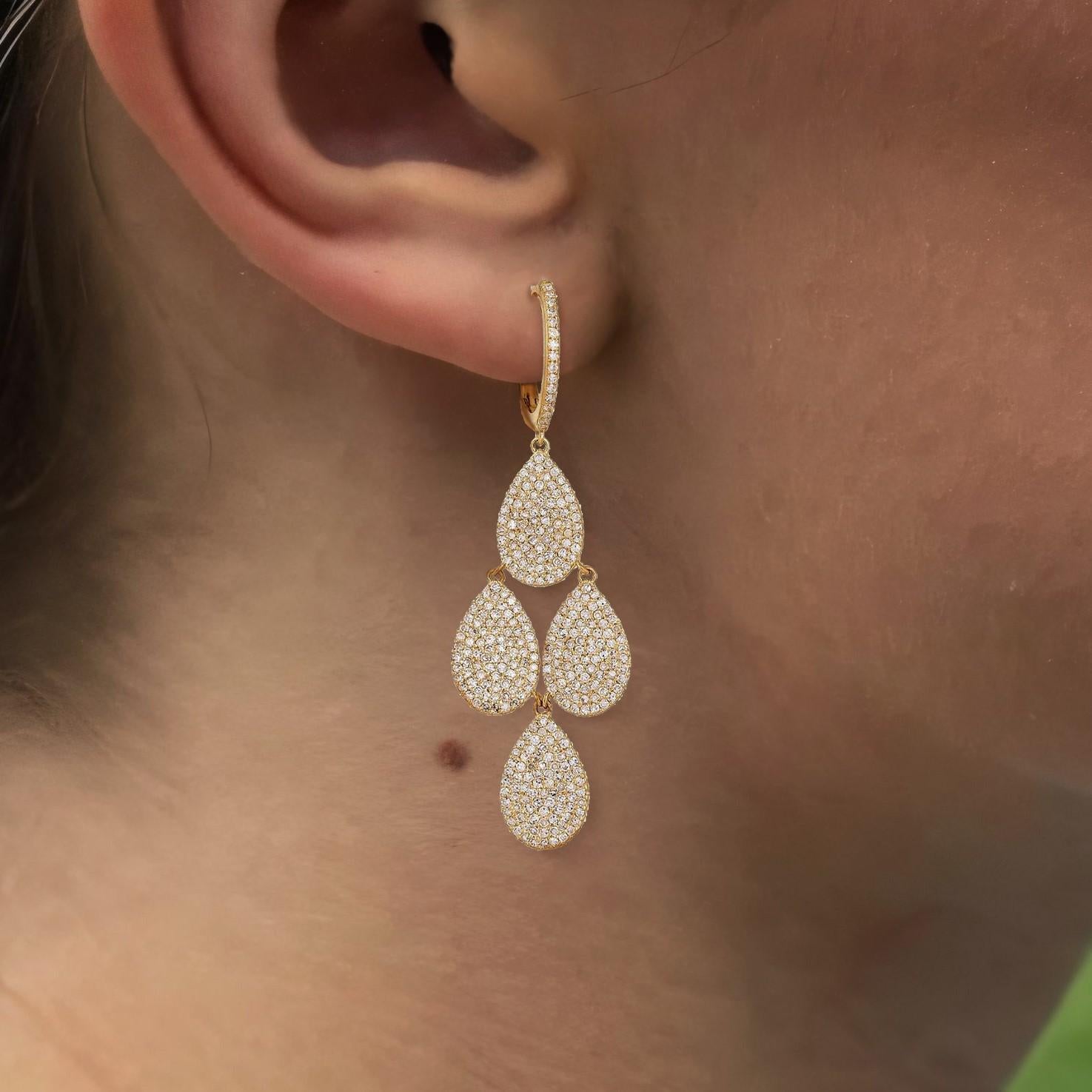 These captivating earrings are crafted in 14K yellow and white gold, featuring natural diamonds totaling 2.73ct. With a weight of 9.02g, the danglers exude elegance and charm, making them the perfect statement piece for any occasion. Their dazzling