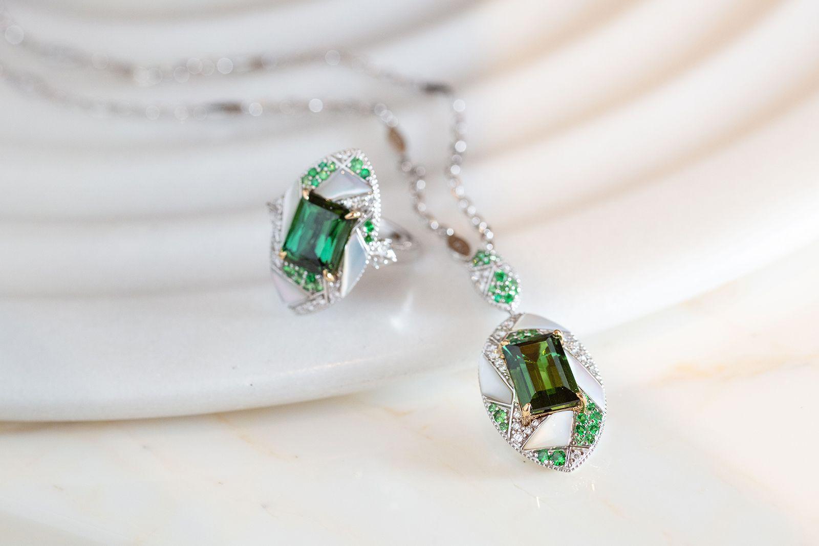 Mystic Green Tourmalines centred on an irregular frame of Tsavorites, Mother of Pearl and Diamonds. Combined with subtle gold detailing the tourmalines are hypnotising with its deep green hue.

Mystic Green Tourmaline Necklace with Tsavorites,