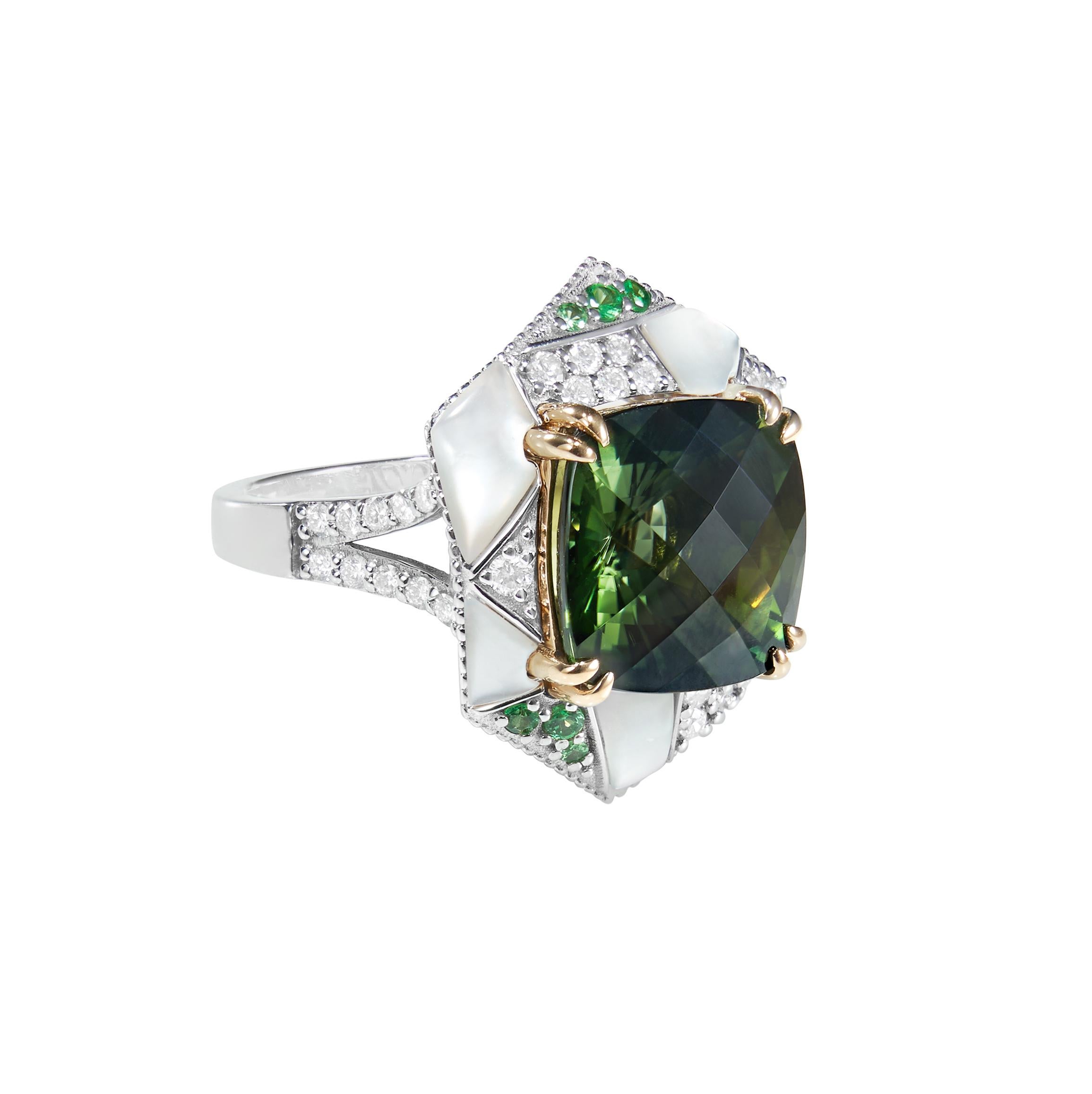 Mystic Green Tourmalines centered on an irregular frame of Tsavorites, Mother of Pearl and Diamonds. Combined with subtle gold detailing the tourmalines are hypnotising with its deep green hue.

Mystic Green Tourmaline Ring with Tsavorites, Mother