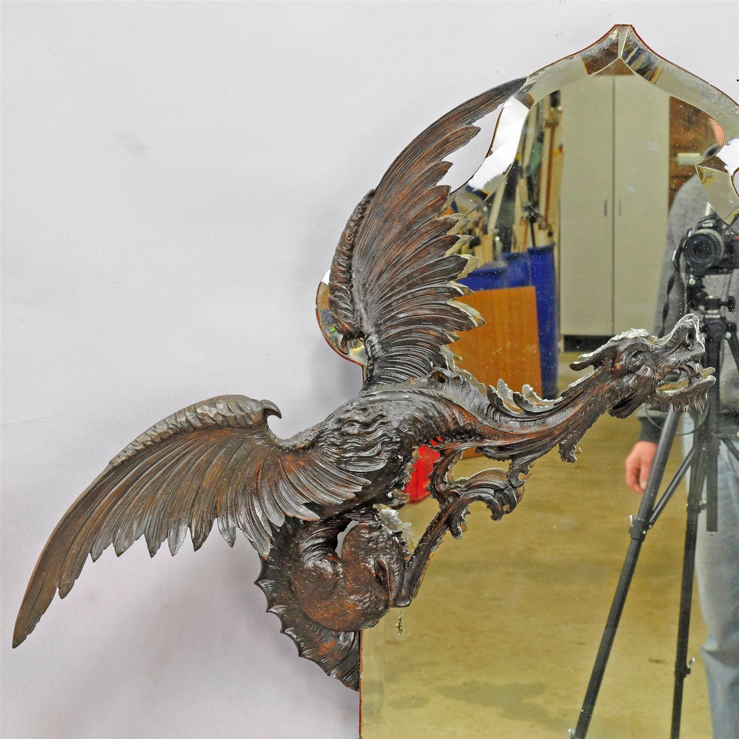 A great mystical wooden dragon sculpture surrounding an old mirror. fantastic handmade woodcarving executed circa 1890 by Testolini, Venezia, Italy in the manner of the works of Gabriel Viardot Paris. Paper label of manufacturer on the back. One