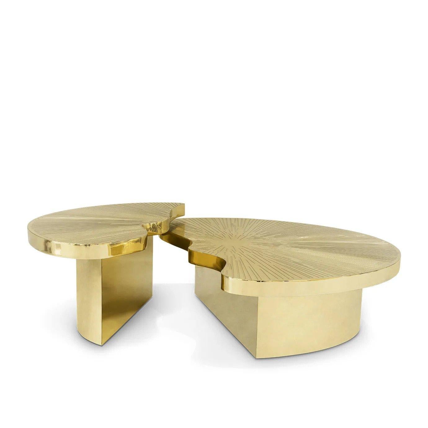 Radiant glamour emanates from the Myth Cocktail Table as two individual brass parts set at varying heights with a shared sun-burst etched top unite creating a statement work of furniture art.