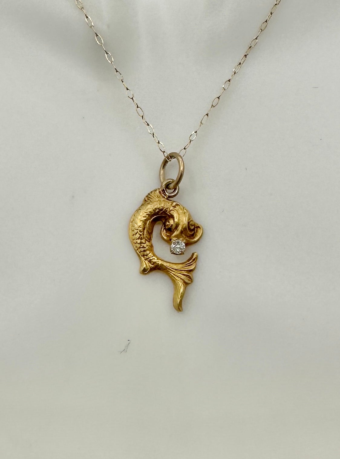THIS IS A STUNNING BEAUX ARTS RENAISSANCE REVIVAL ART NOUVEAU GOLD PENDANT OF A MYTHICAL FISH SEA CREATURE DRAGON WITH A STUNNING ANTIQUE OLD MINE CUT DIAMOND IN ITS MOUTH.
This is a beautiful and rare Beaux Arts - Art Nouveau - Belle Epoque pendant