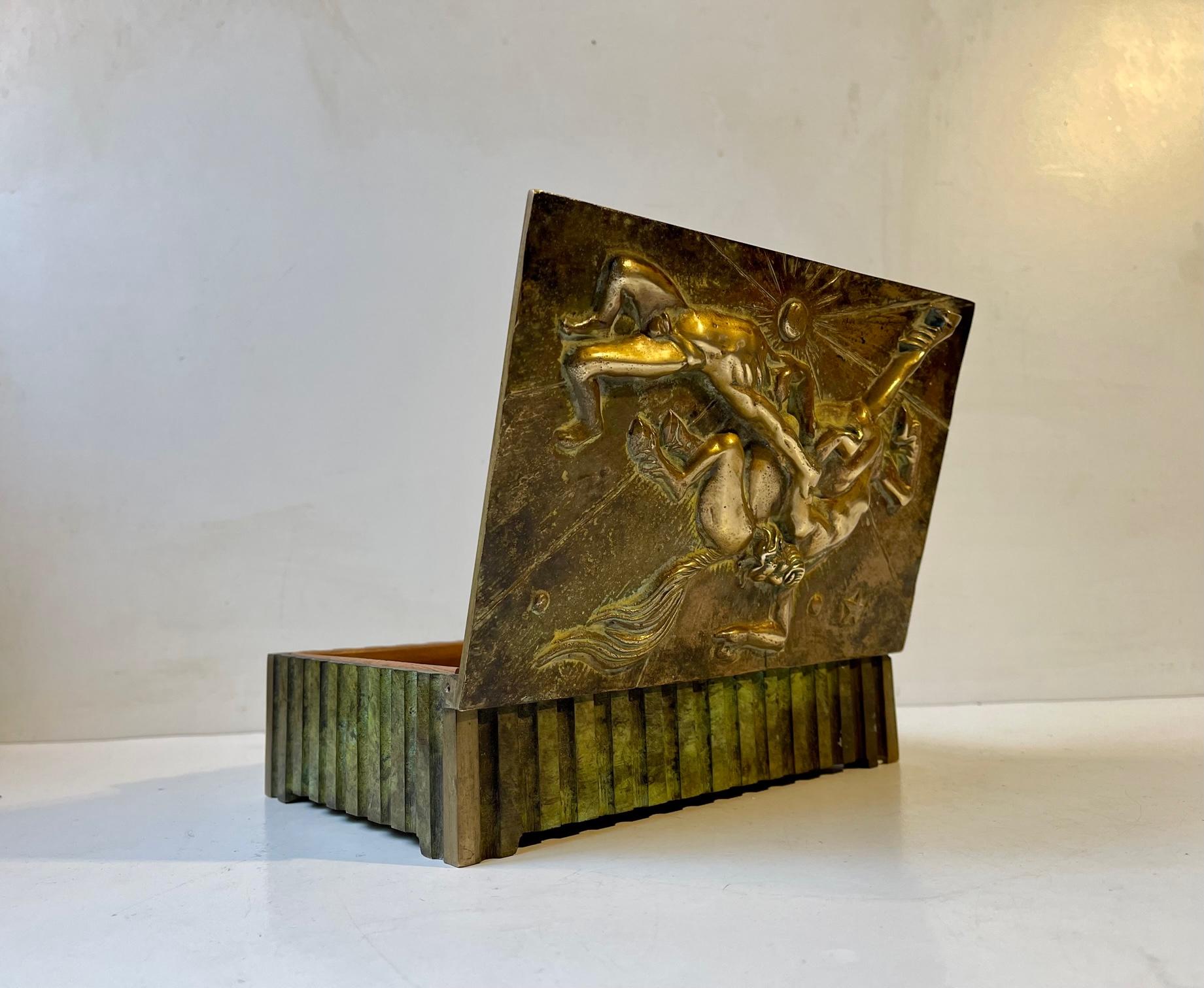 - Heavy Art Deco bronze box with deep ribbings. 
- Clean and strict architectural design.
- Masculine and powerfull appearance
- Mythological scene in relief with centaurs or Ixionida in combat with man. 
- Rich and original patina 
- It was