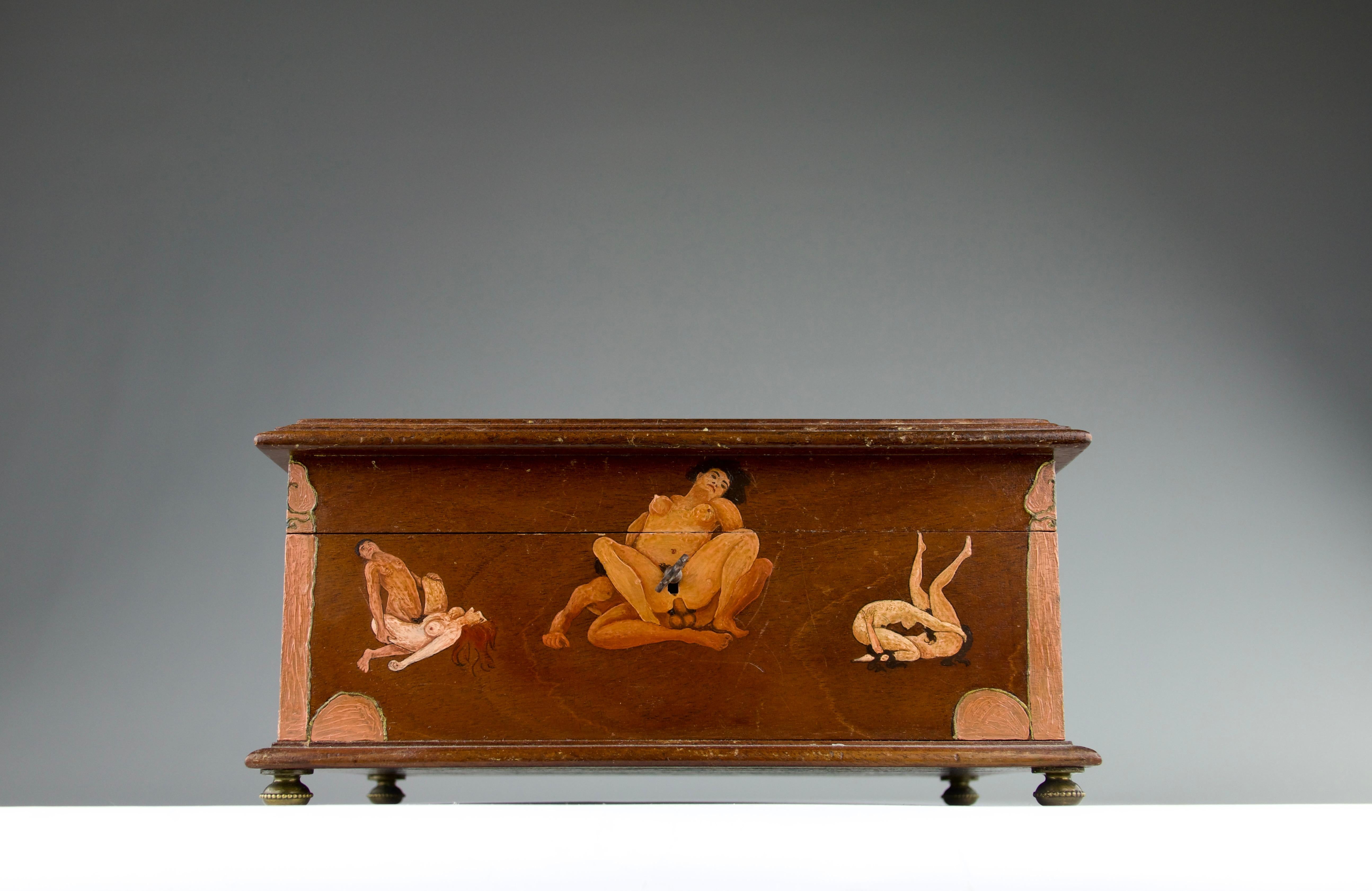 Superb and rare erotic lockbox from the late 1800s originating from France. Sensually decorated and painted with depictions of mythological fauns, women, men, and totems in various sexual and erotic positions of ecstasy, pleasure, intimacy and