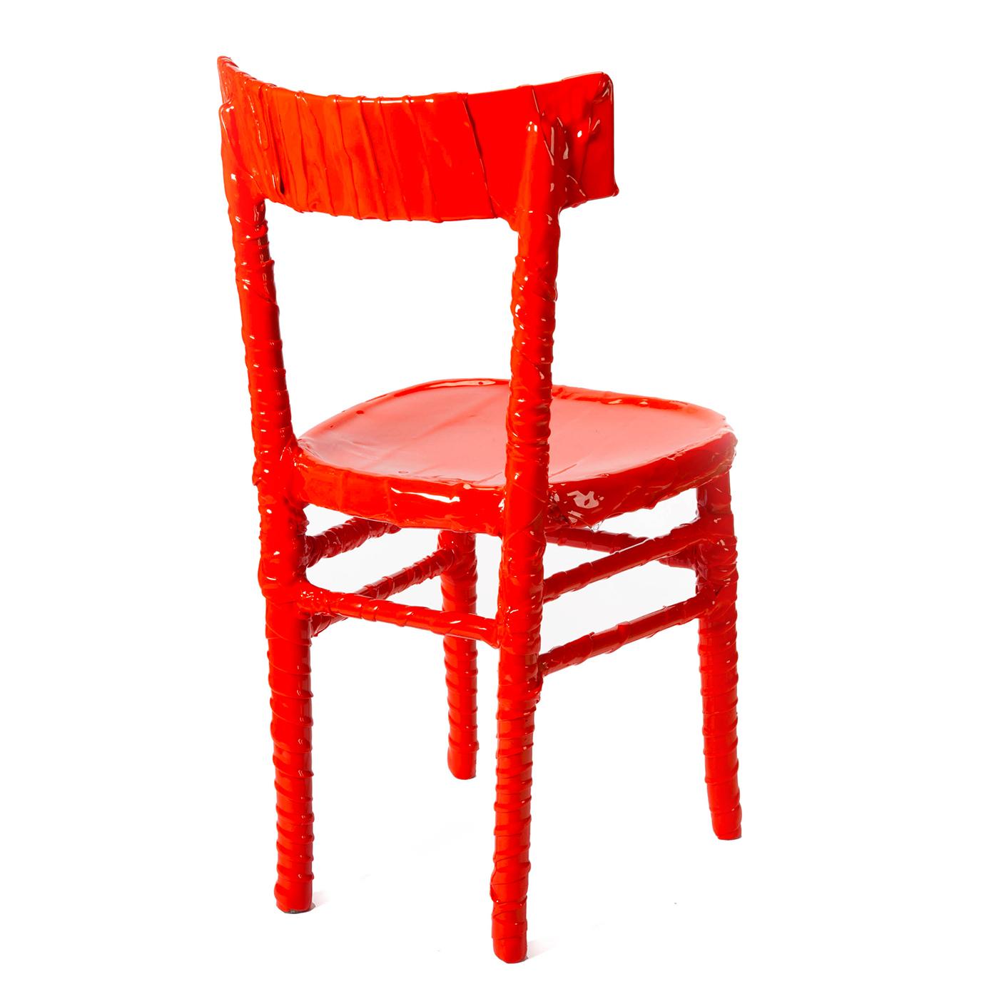 Designed by Paola Navona in 2019, this upcycled chair is part of the One-Off Collection. The chair, once abandoned, has been given a new life and coated in bright orange resin by the expert artisans of Corsi Design Factory. No two pieces are exactly