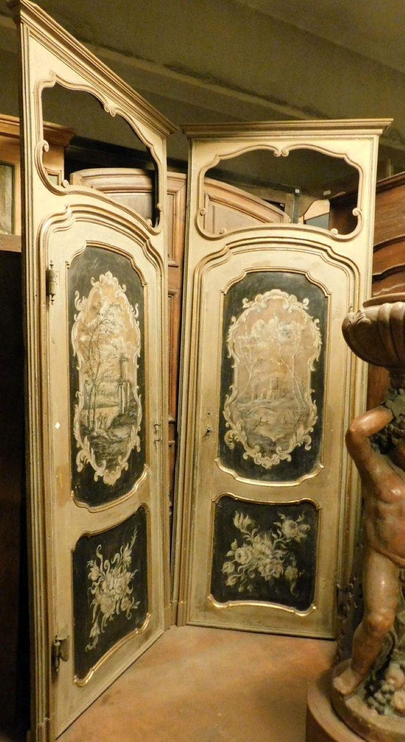 Two prestigious antique interior doors, made of solid walnut and richly painted with a beige and black background, complete with frame and original overdoor. The overdoor had space for a painting or mirror. Original 18th-century Italian doors. One