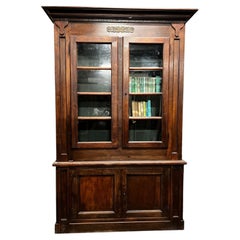 Elegant bookcase in walnut and poplar, with gilded trim, Italy