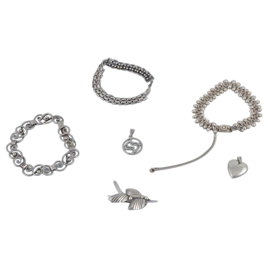 N. E. From and others. Three bracelets, one brooch, and two pendants. For Sale