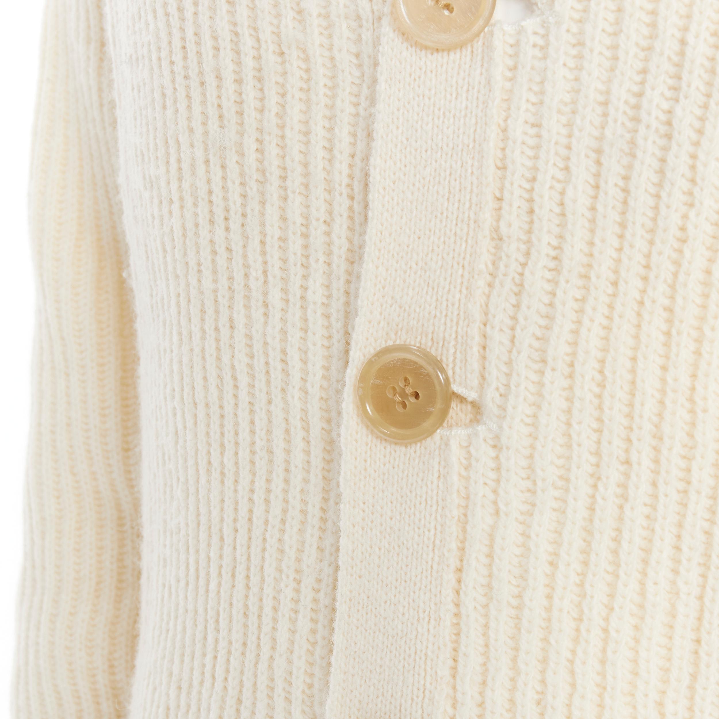 N HOOLYWOOD 100% wool beige ribbed fisherman cardigan sweater UK36 S 
Reference: JOMK/A00022 
Brand: N Hoolywood 
Material: Wool 
Color: Beige 
Pattern: Solid 
Closure: Button 
Extra Detail: Resin button. Dual patch pockets. Cuffed sleeves. 
Made