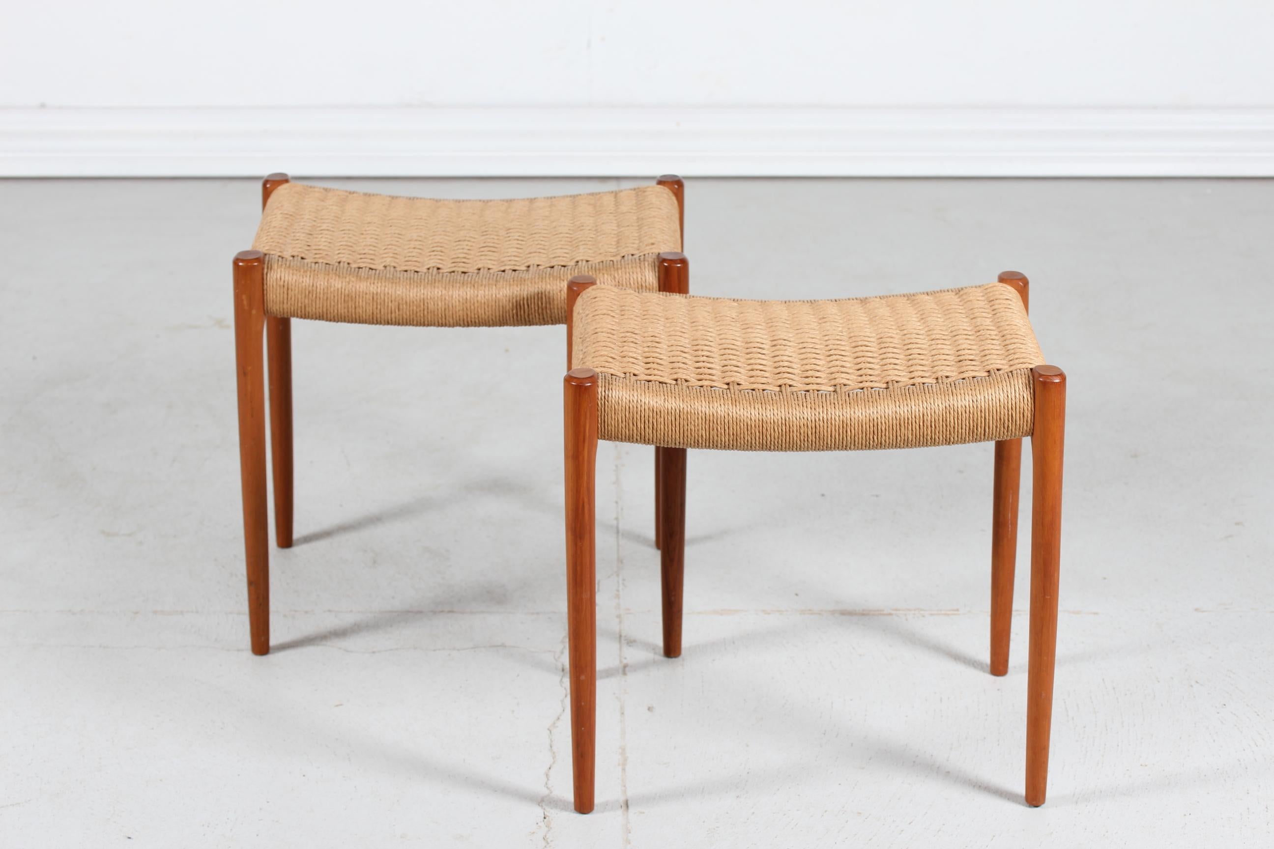 A pair of stools model no. 80A designed in 1963 by the Danish cabinet maker and furniture designer Niels Otto Møller (1920-1982) manufactured by J. L. Møllers Møbelfabrik, Aarhus, Denmark in the 1960s.

The stools are made of solid teak with seat